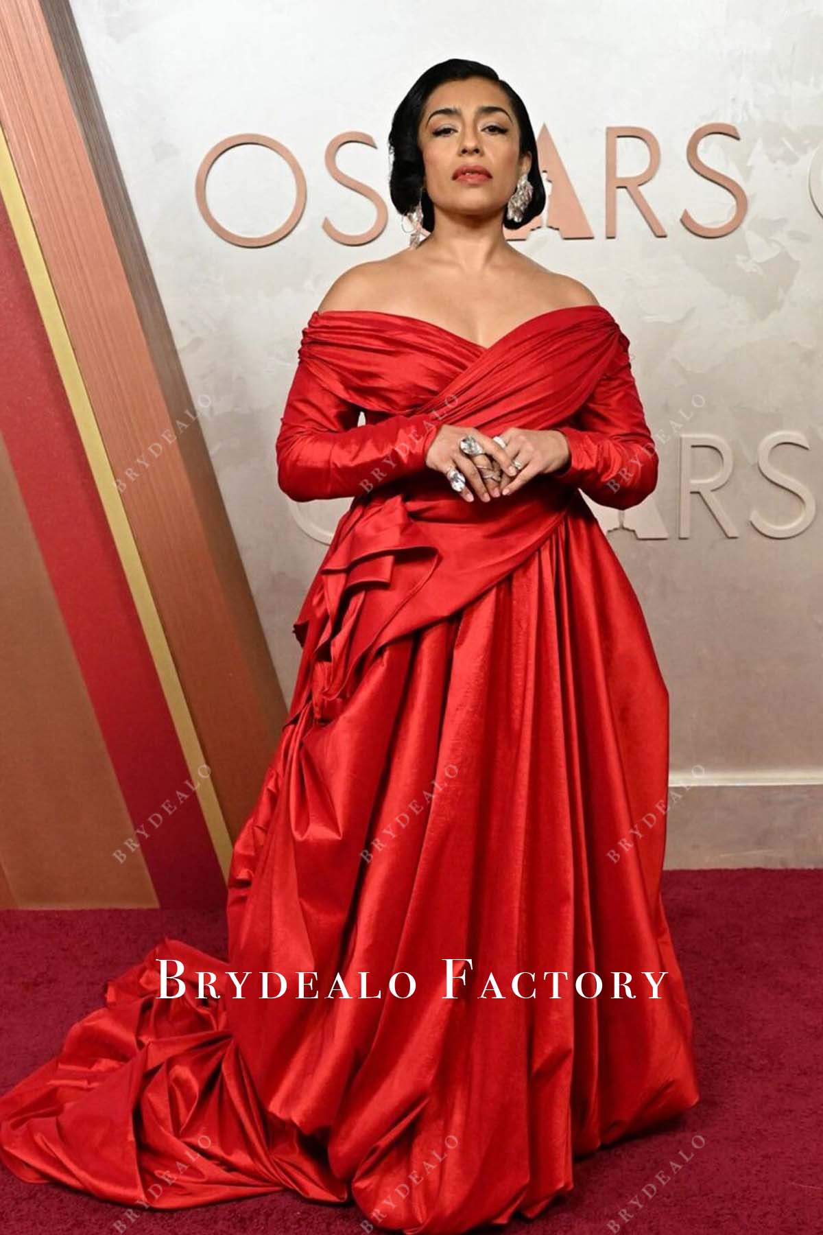 Adriana Paz red 2025 Oscars red carpet v neck dress