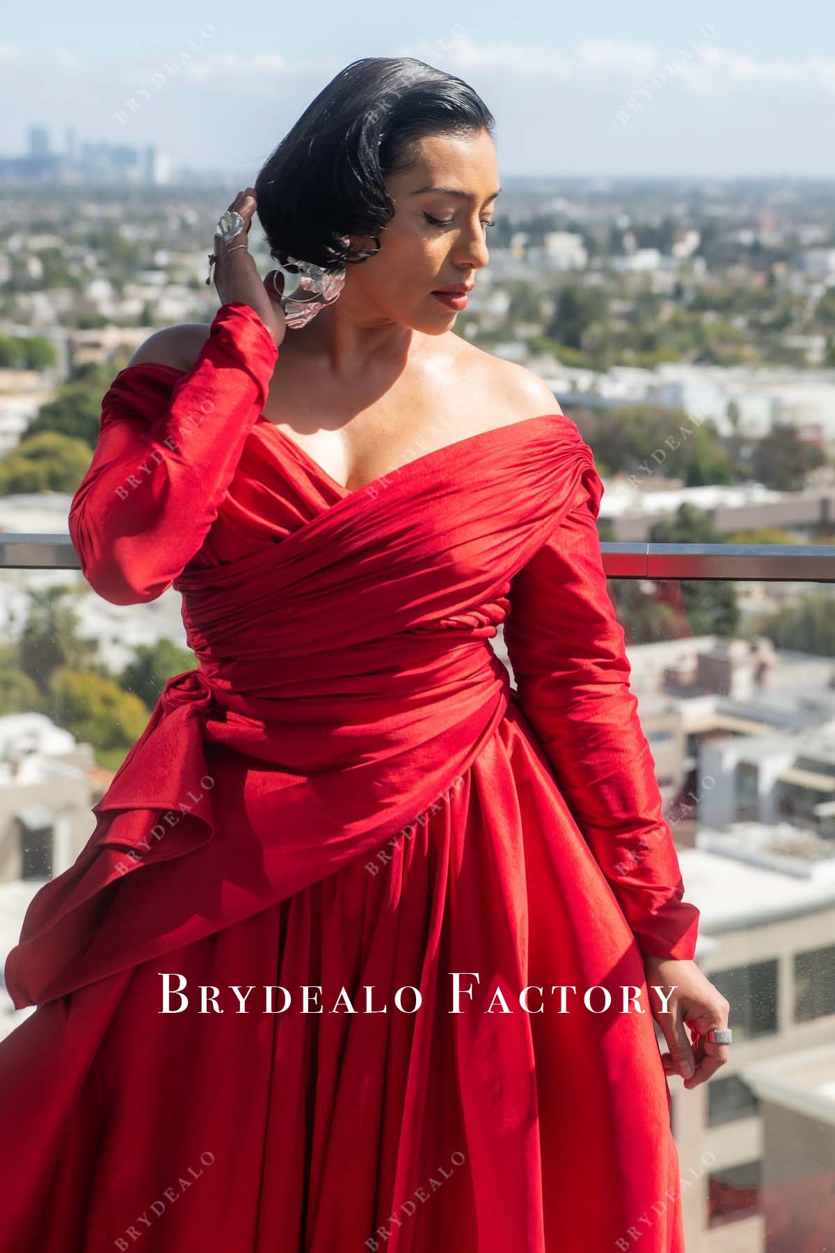 Adriana Paz red off shoulder 2025 Oscars red carpet dress