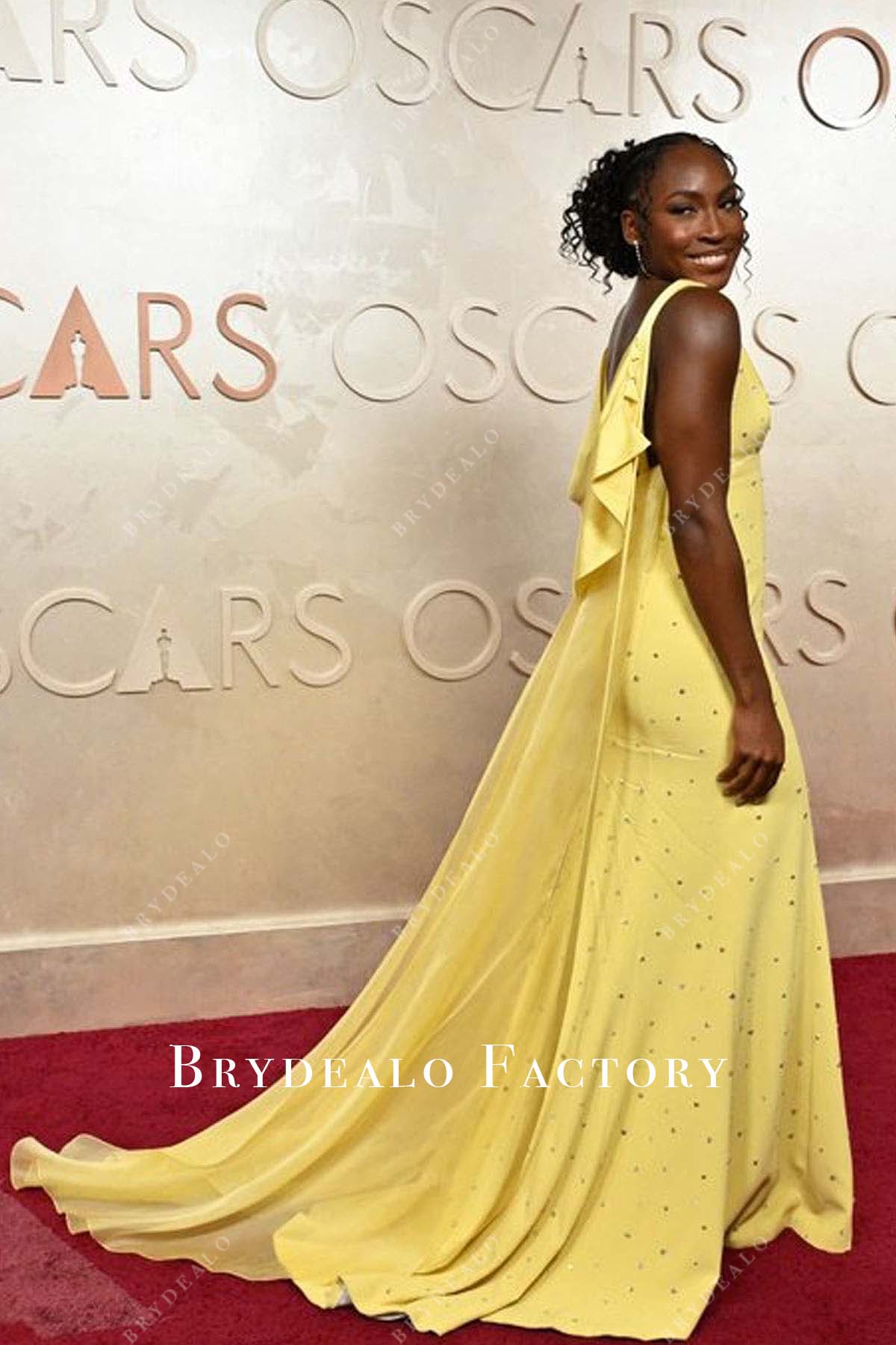 Coco Gauff yellow cape 2025 Oscars red carpet dress
