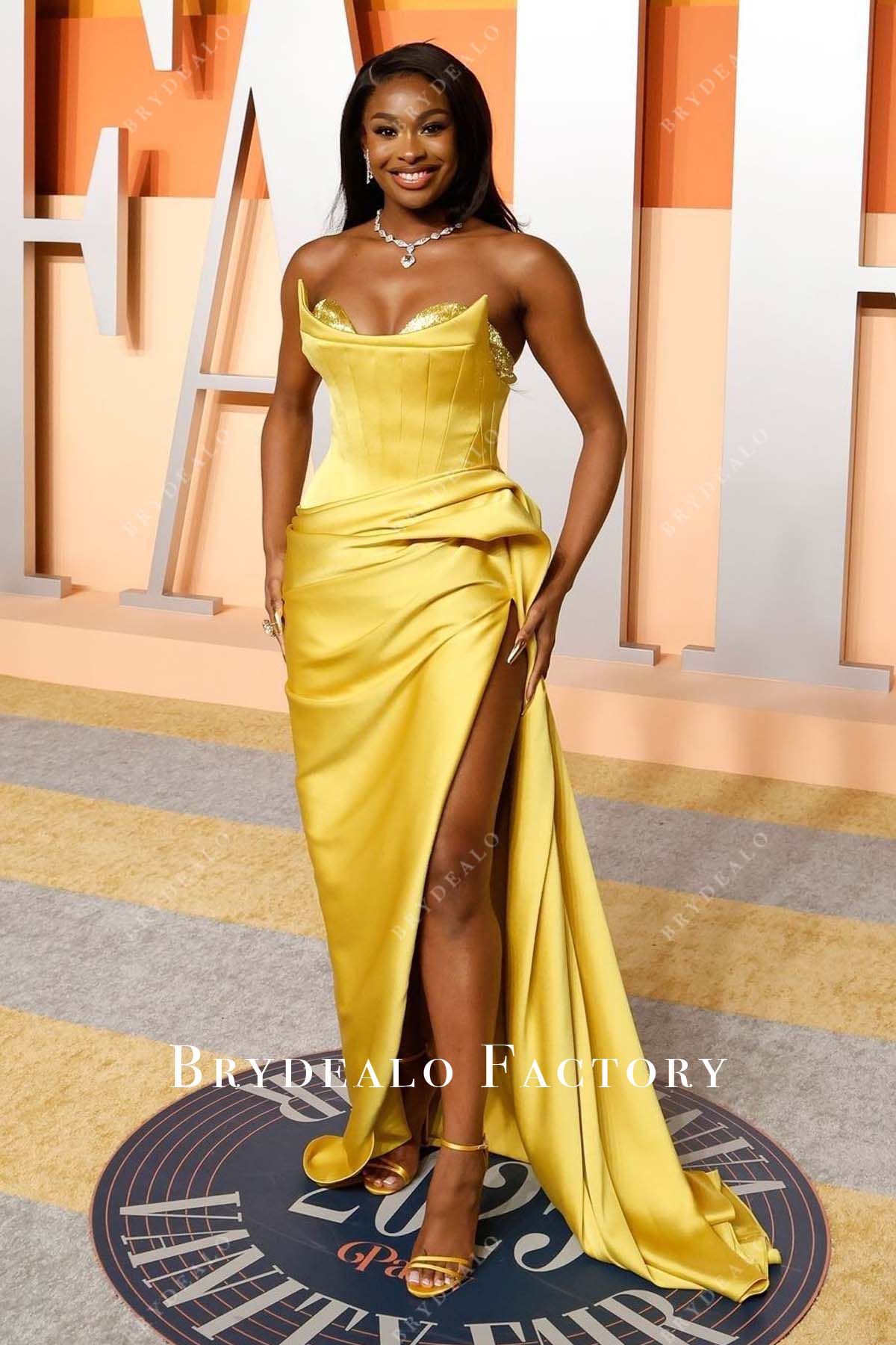 Coco Jones 2025 thigh split Vanity fair party dress