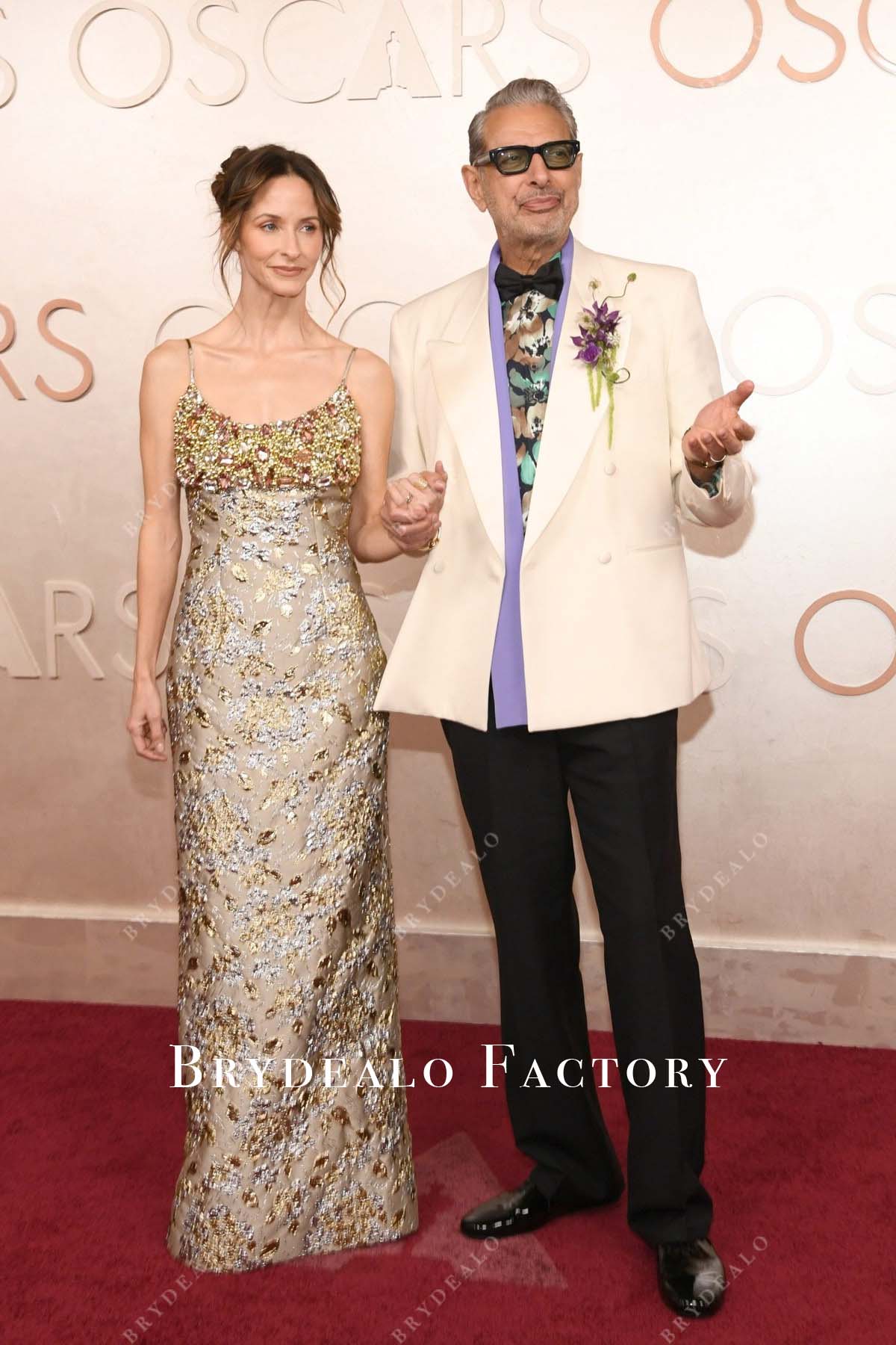 Emilie Livingston taupe thin straps 2025 Oscars red carpet dress