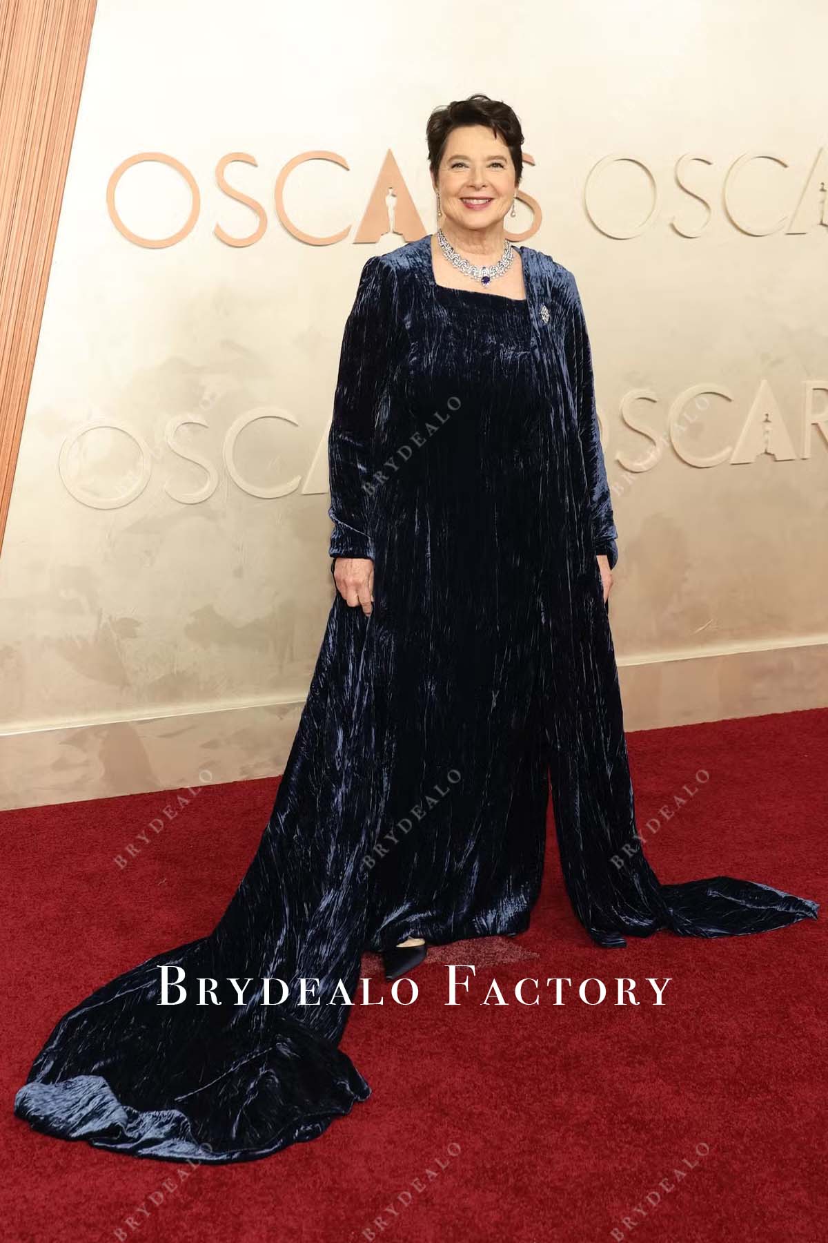 Isabella Rossellini dark navy 2025 Oscars red carpet long sleeves prom dress