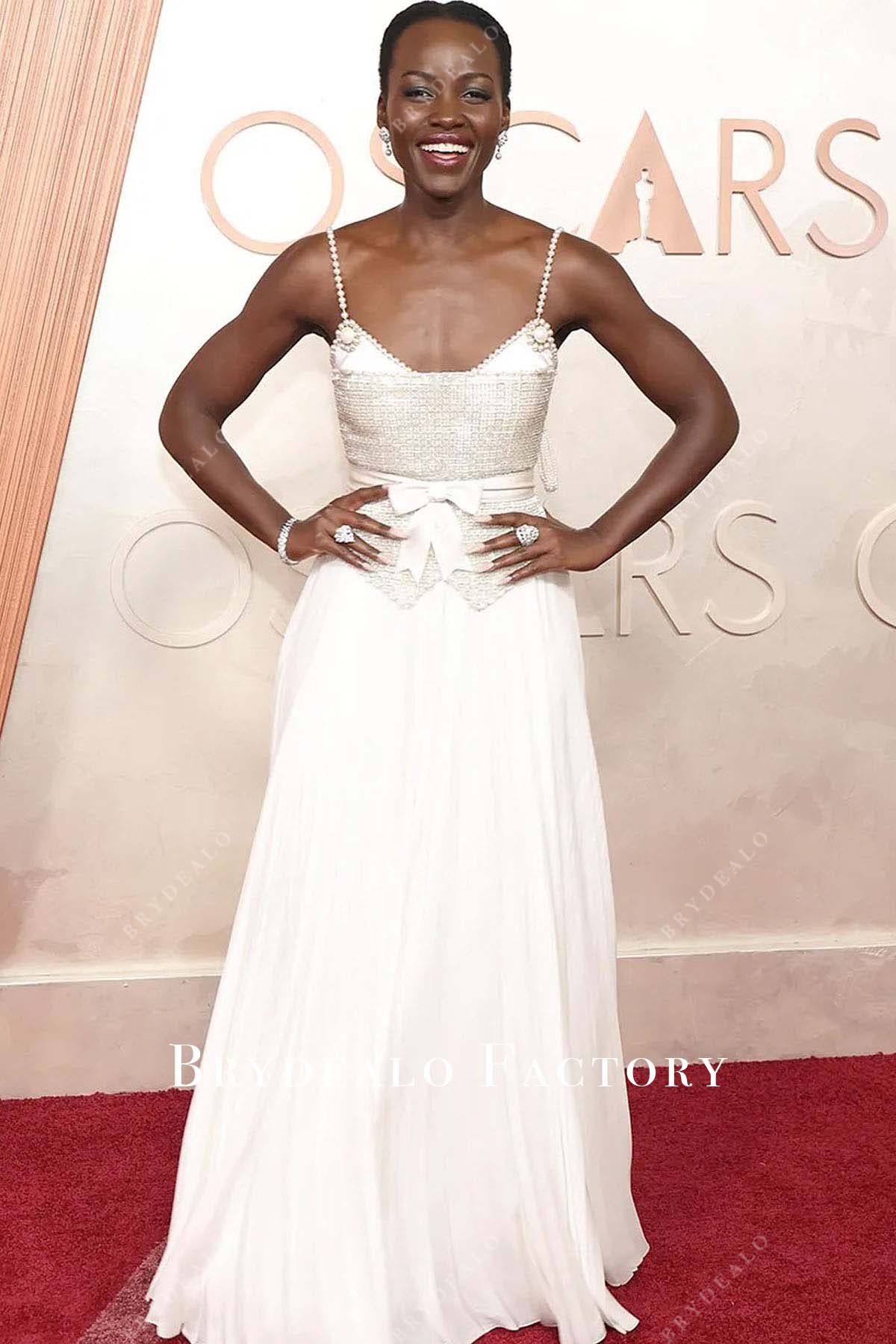 Lupita Nyong’o white chiffon 2025 Oscars red carpet dress