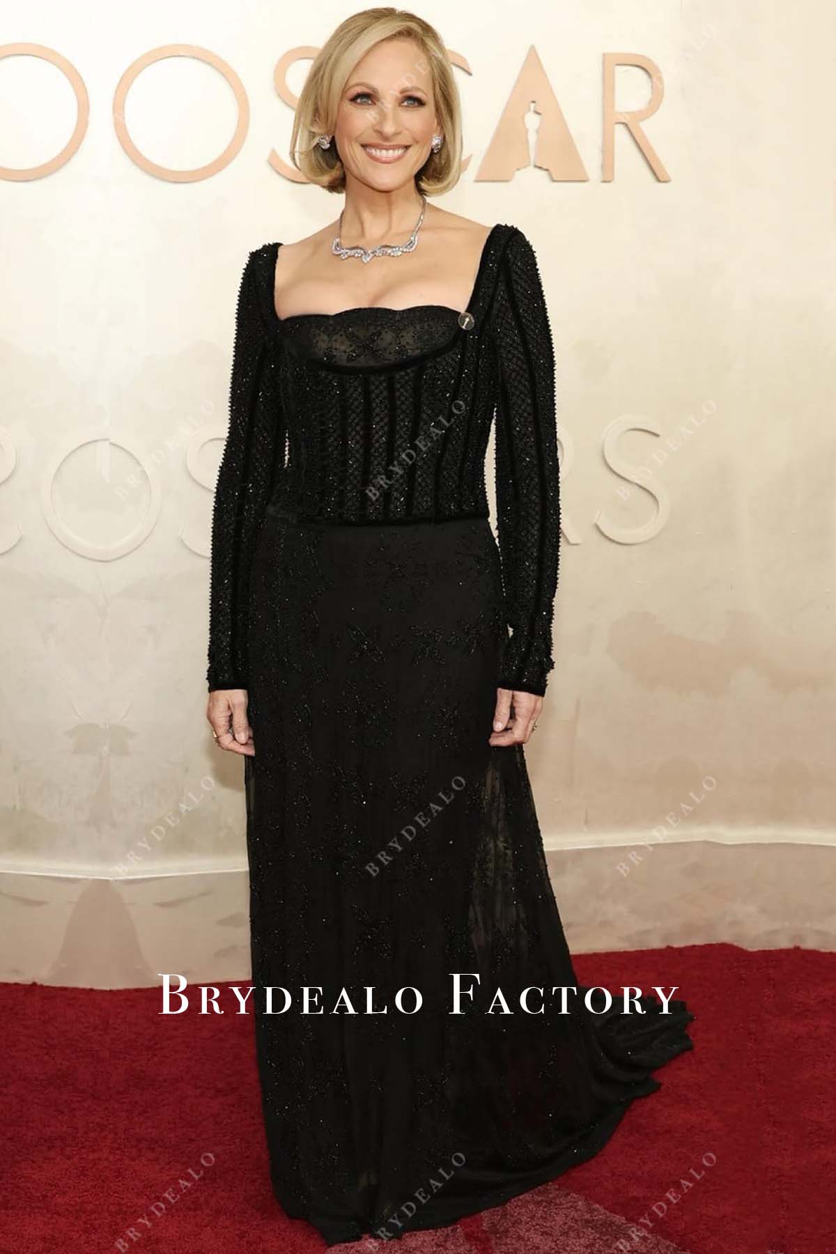 Marlee Matlin scalloped neck 2025 Oscars red carpet dress