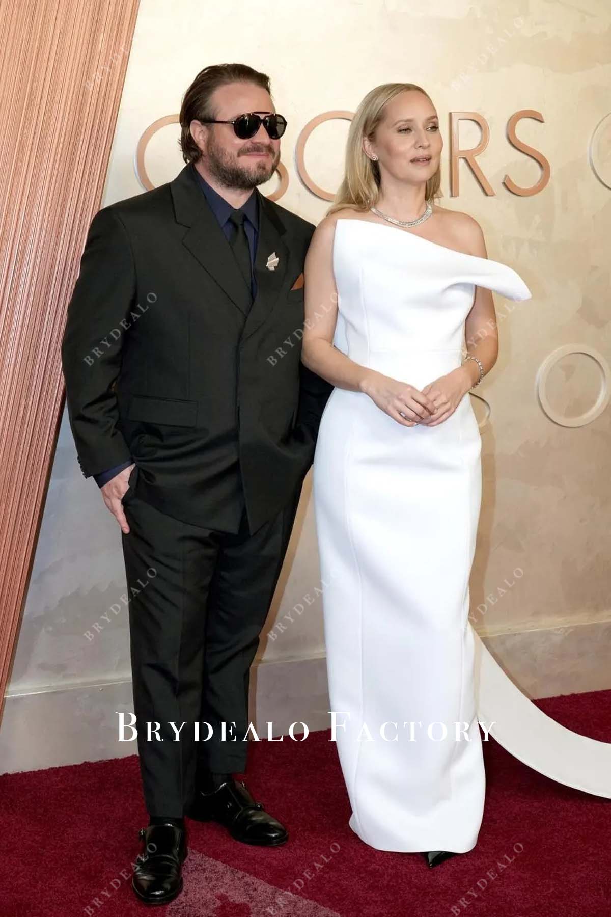 Mona Fastvold white strapless 2025 Oscars red carpet dress