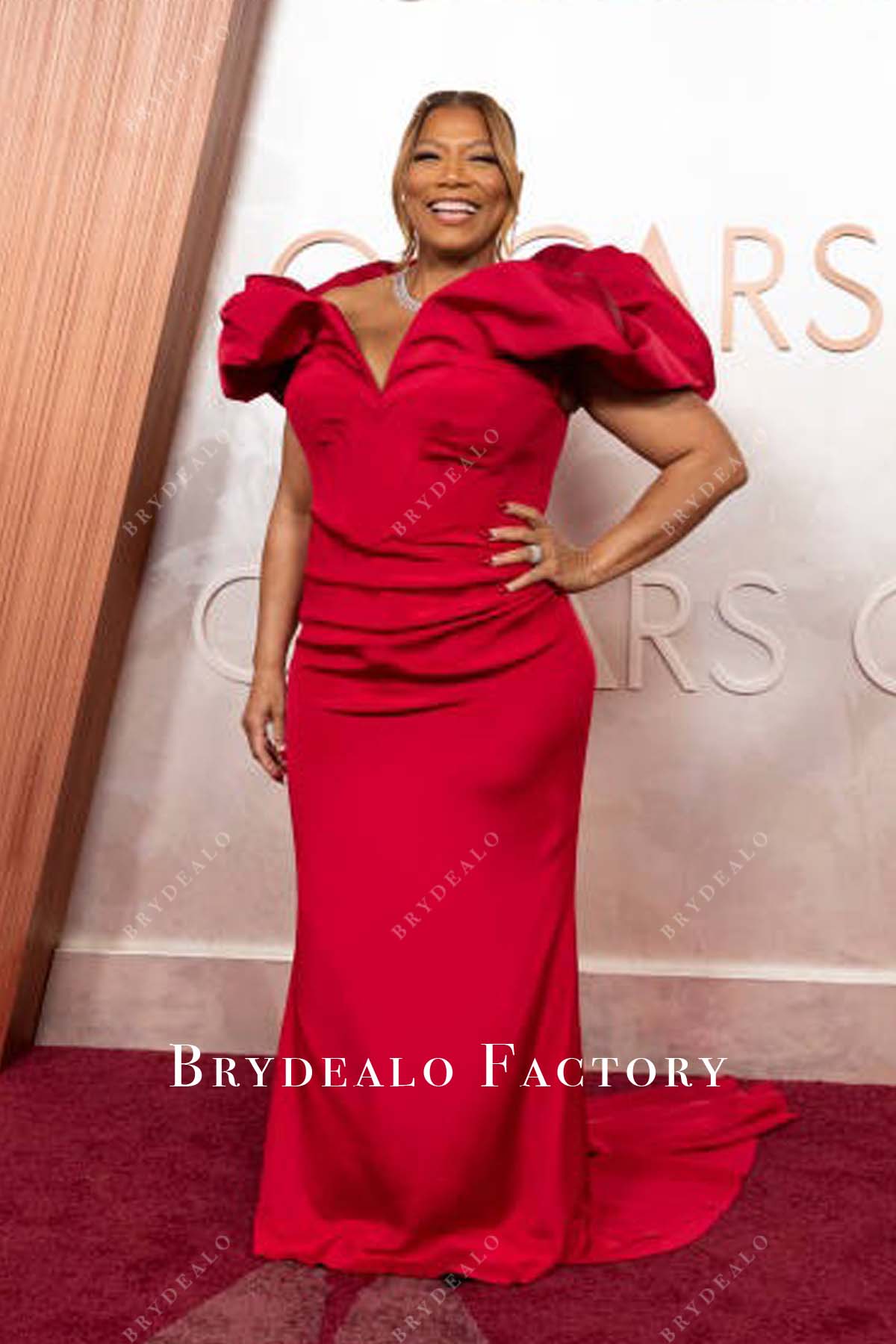 Queen Latifah fit flare 2025 Oscars red carpet dress