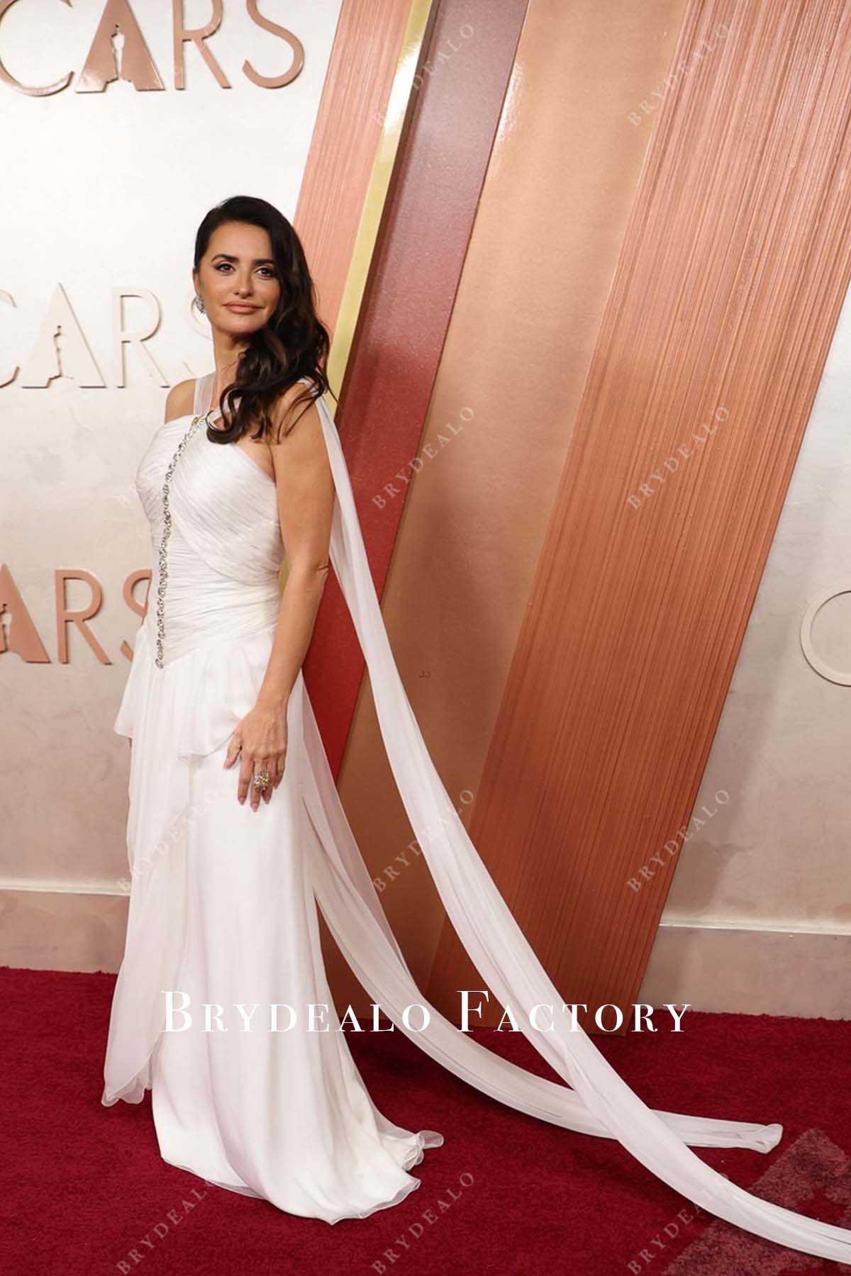 backless Penélope Cruz white chiffon 2025 Oscars red carpet dress