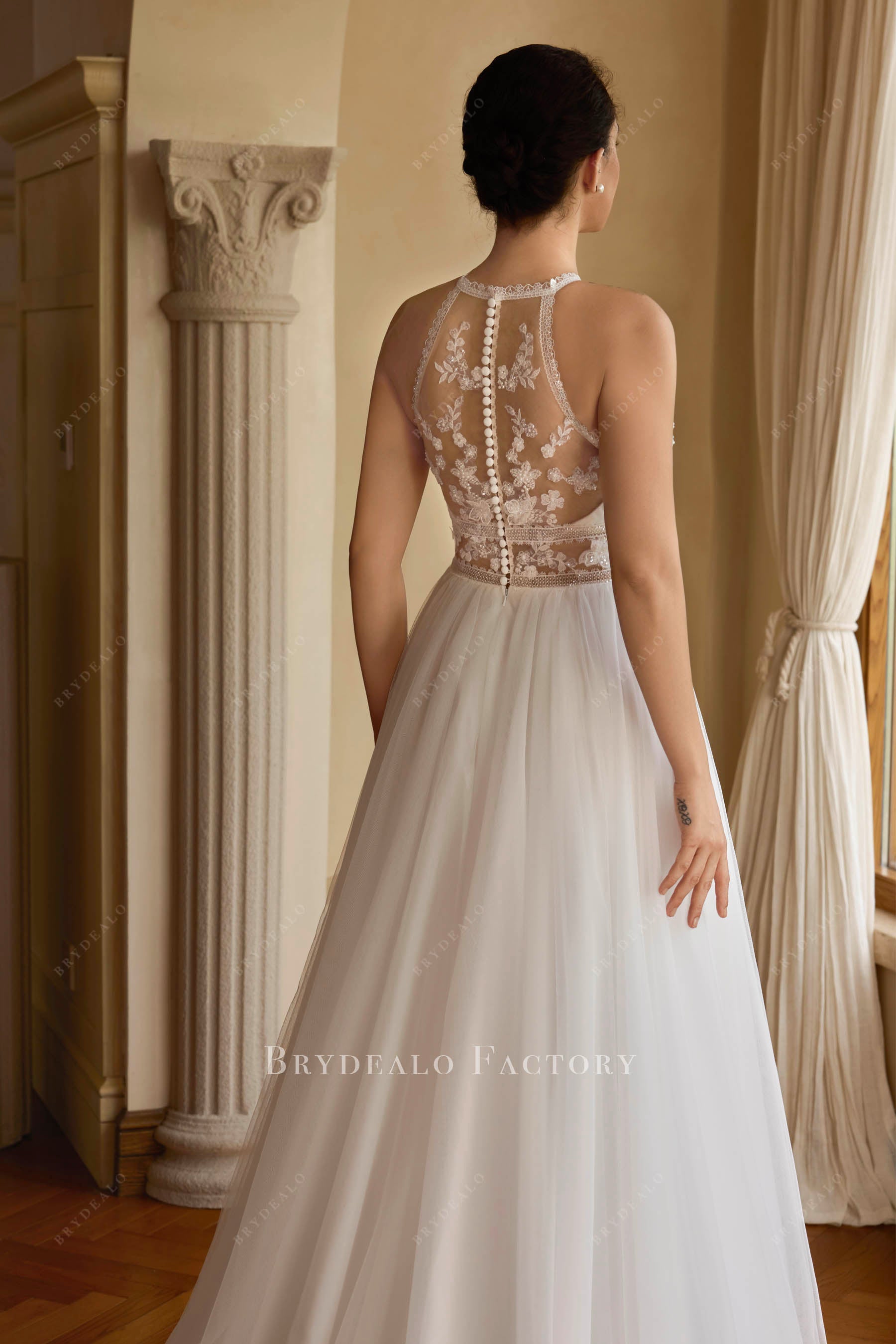buttoned illusion lace back bridal gown