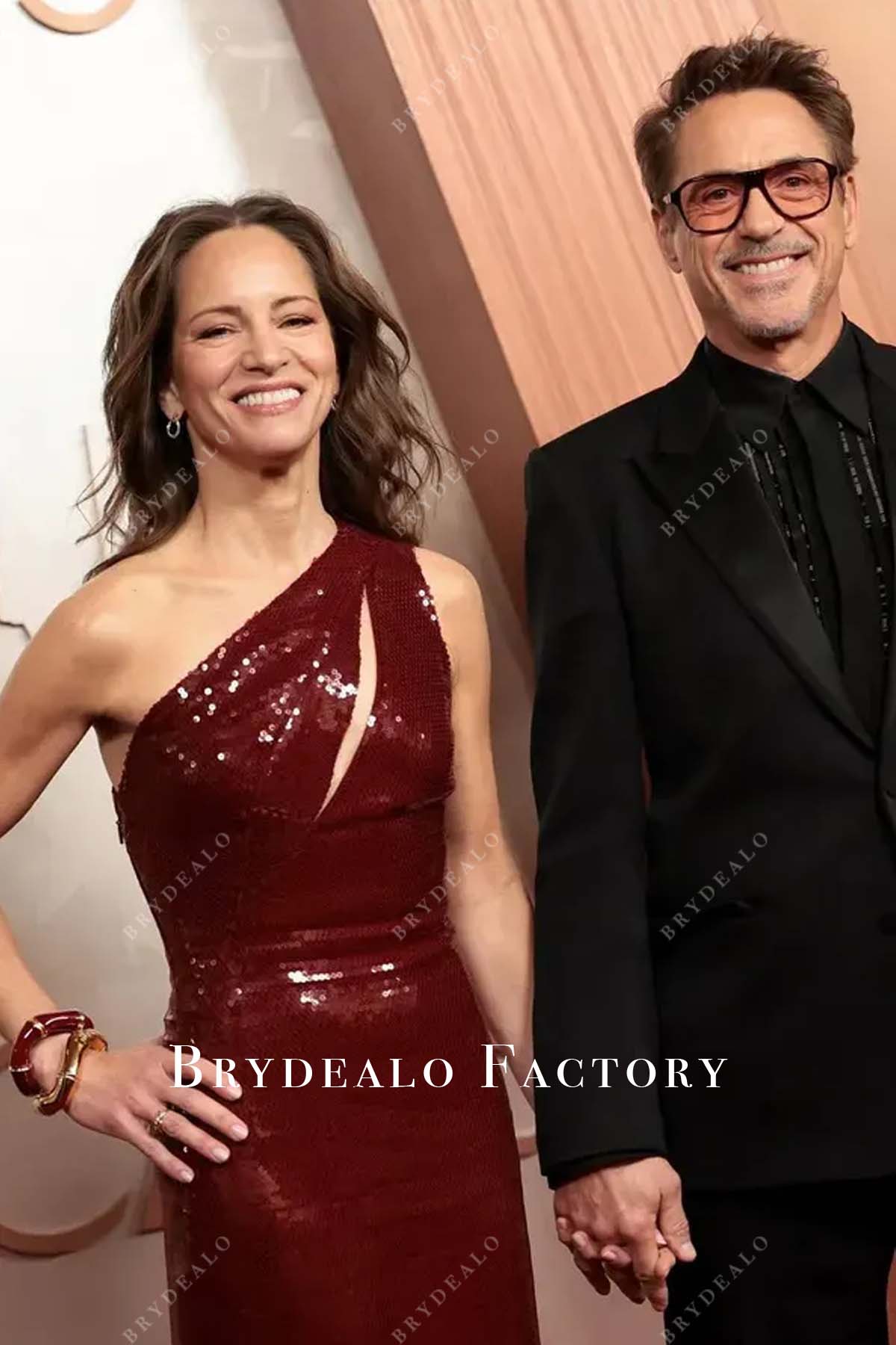 one shoulder Susan Downey burgundy 2025 Oscars red carpet dress