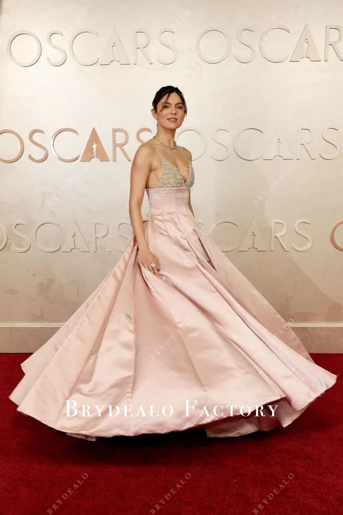 pink Monica Barbaro floor length formal dress 2025 Oscars red carpet dress