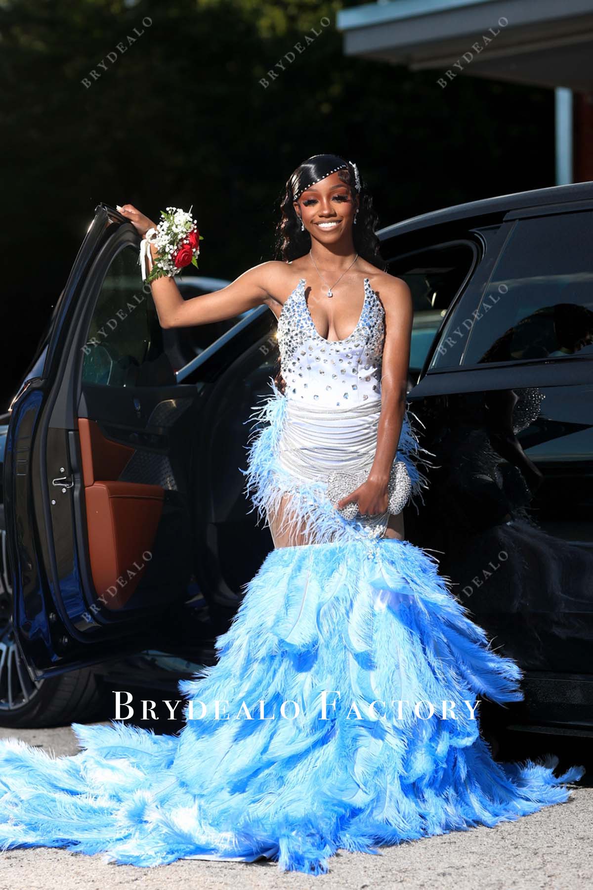 plunging neck blush ostrich feather senior prom dress