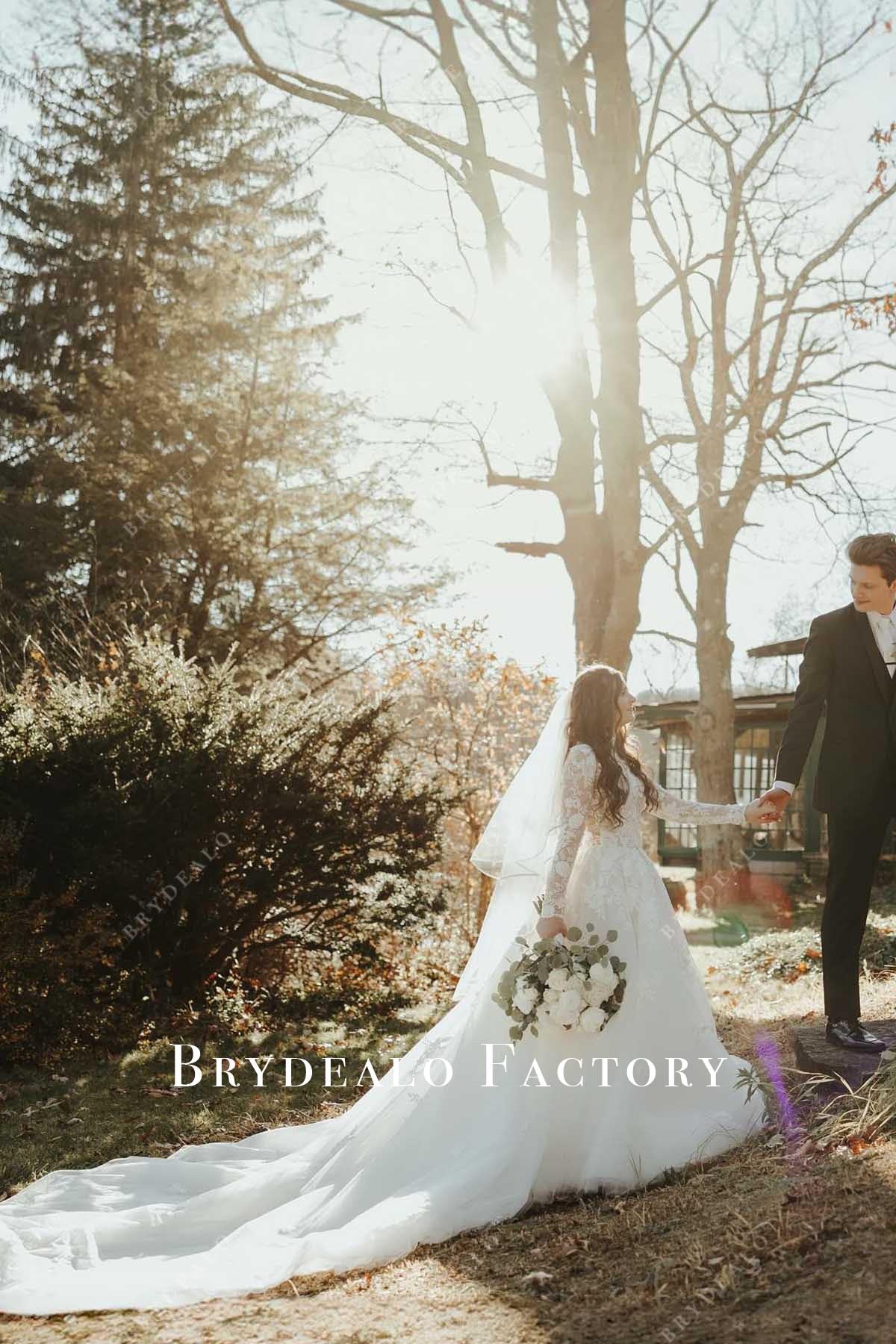 white lace cathedral train wedding dress