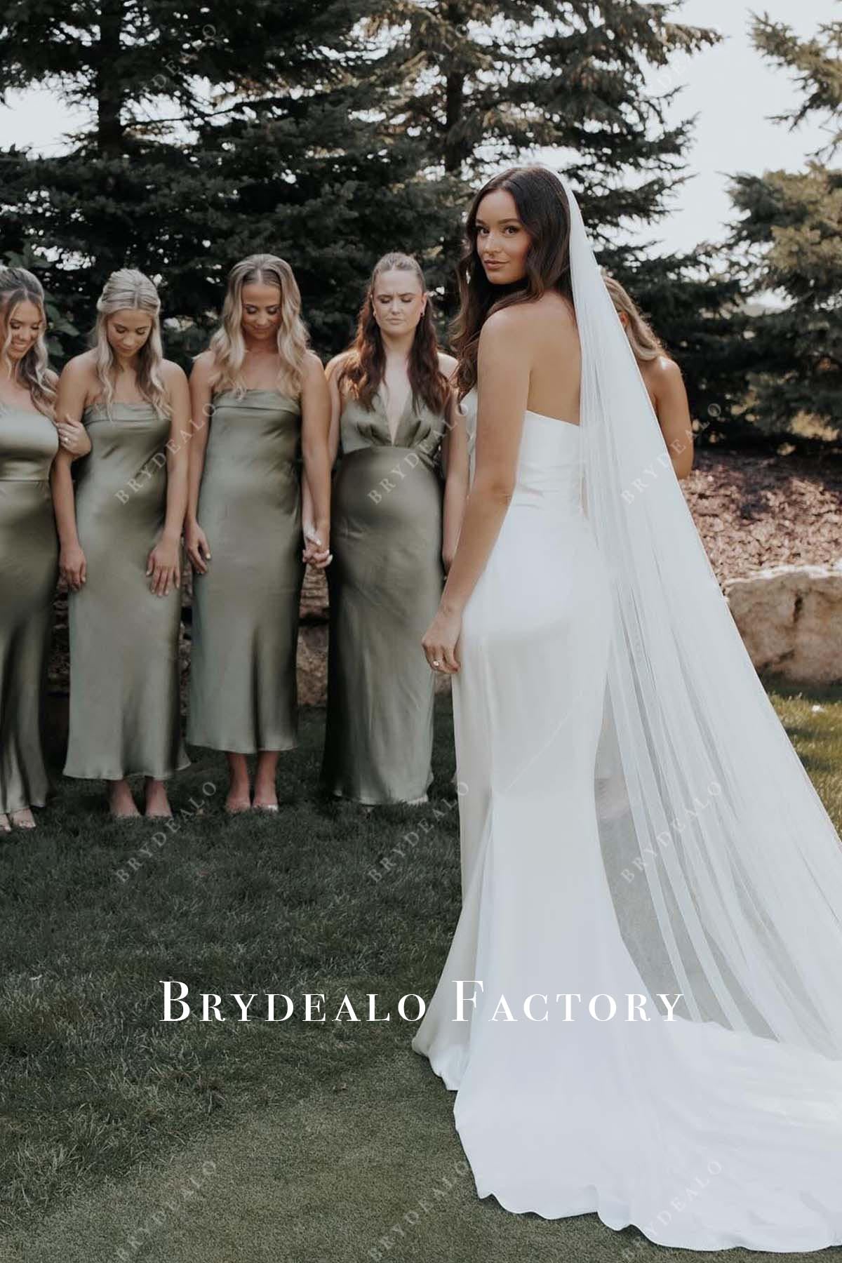 white mermaid chapel train wedding dress