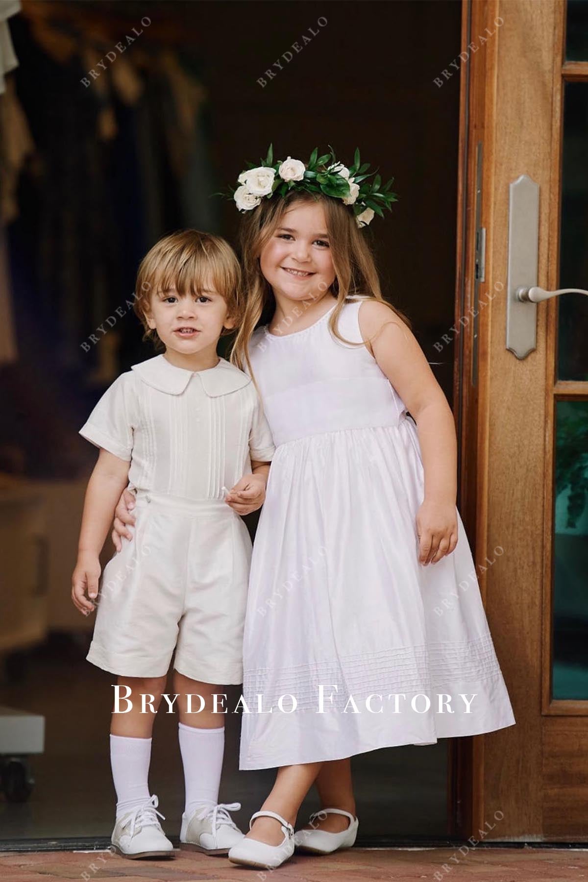 white sleeveless flower girl dress