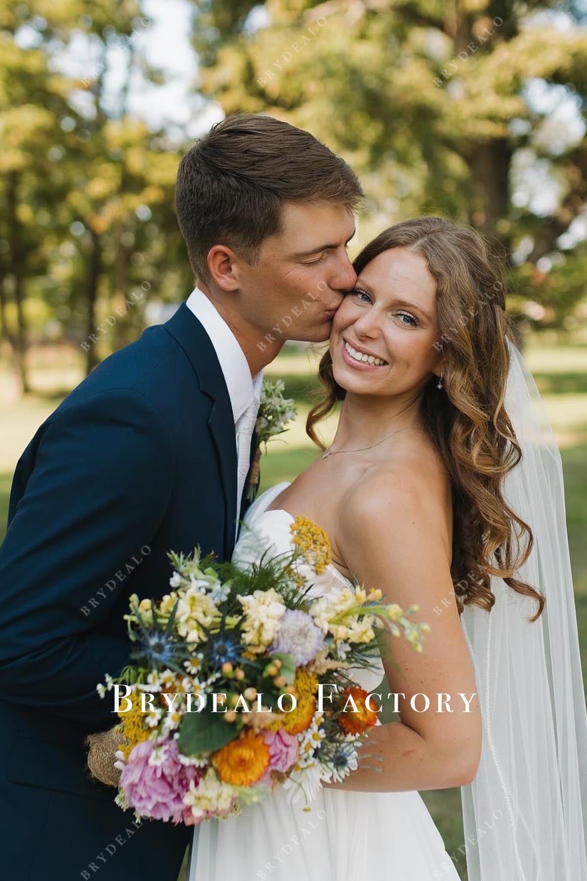 white strapless pleated wedding dress