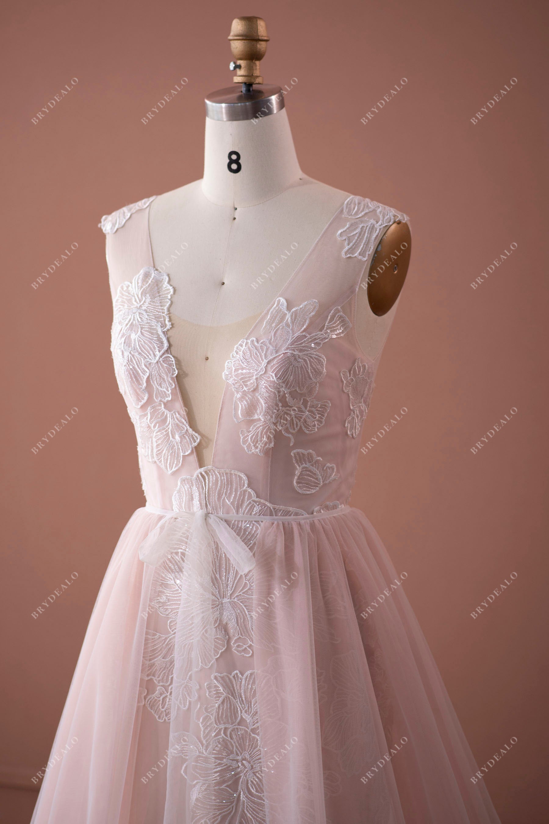 sleeveless plunging V-neck colored bridal gown