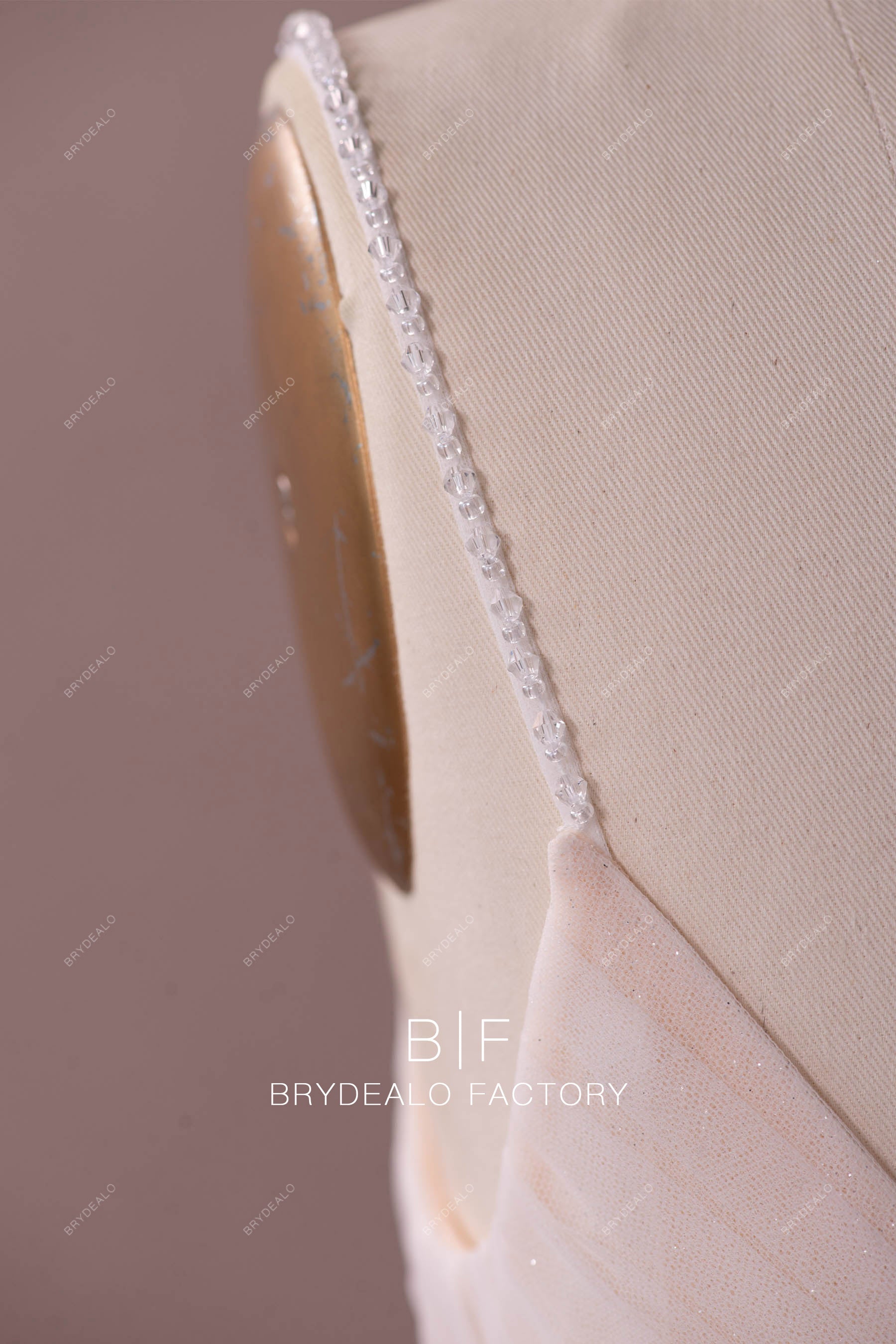 designer bridal gown hand-sewn beaded straps