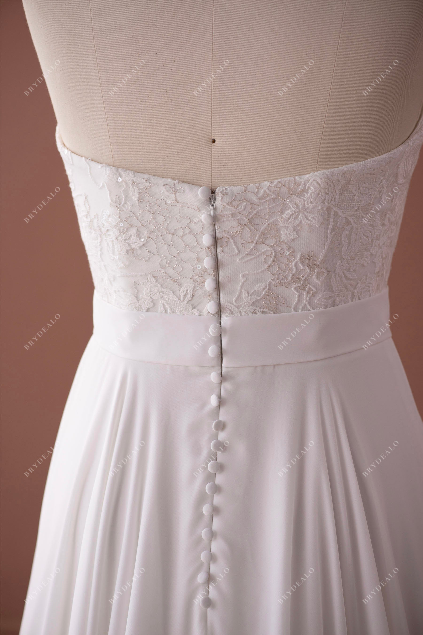 designer buttoned back lace wedding gown