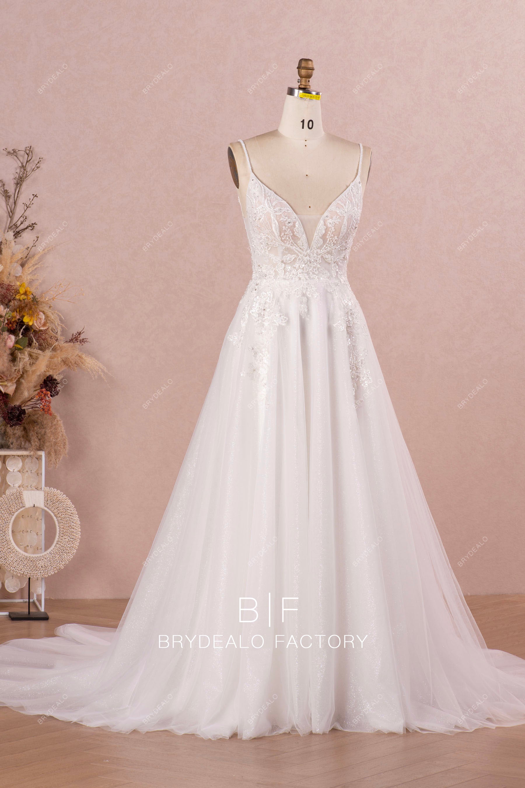 chapel train sleeveless plunging neck wedding dress