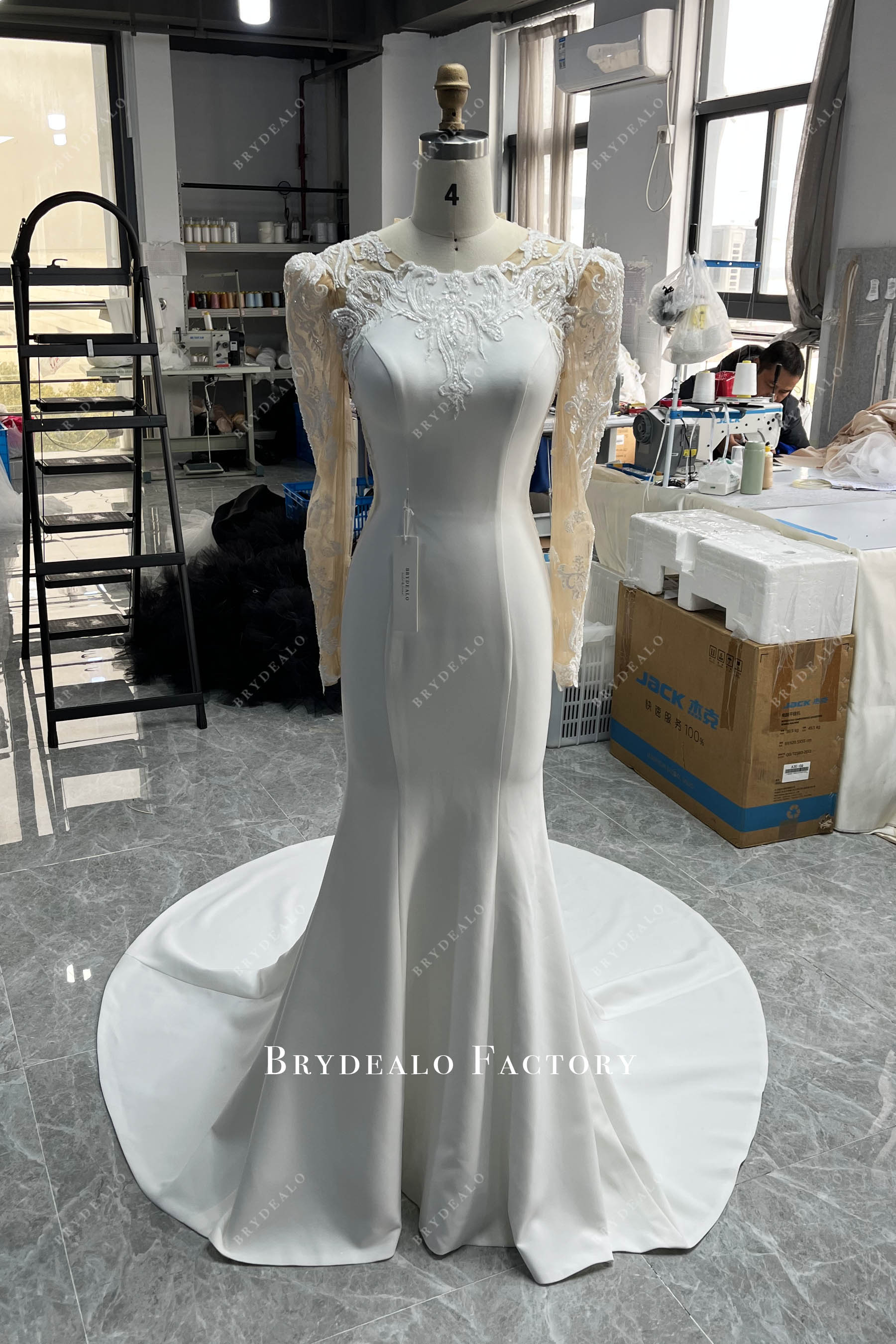 designer illusion long sleeve crepe bridal gown