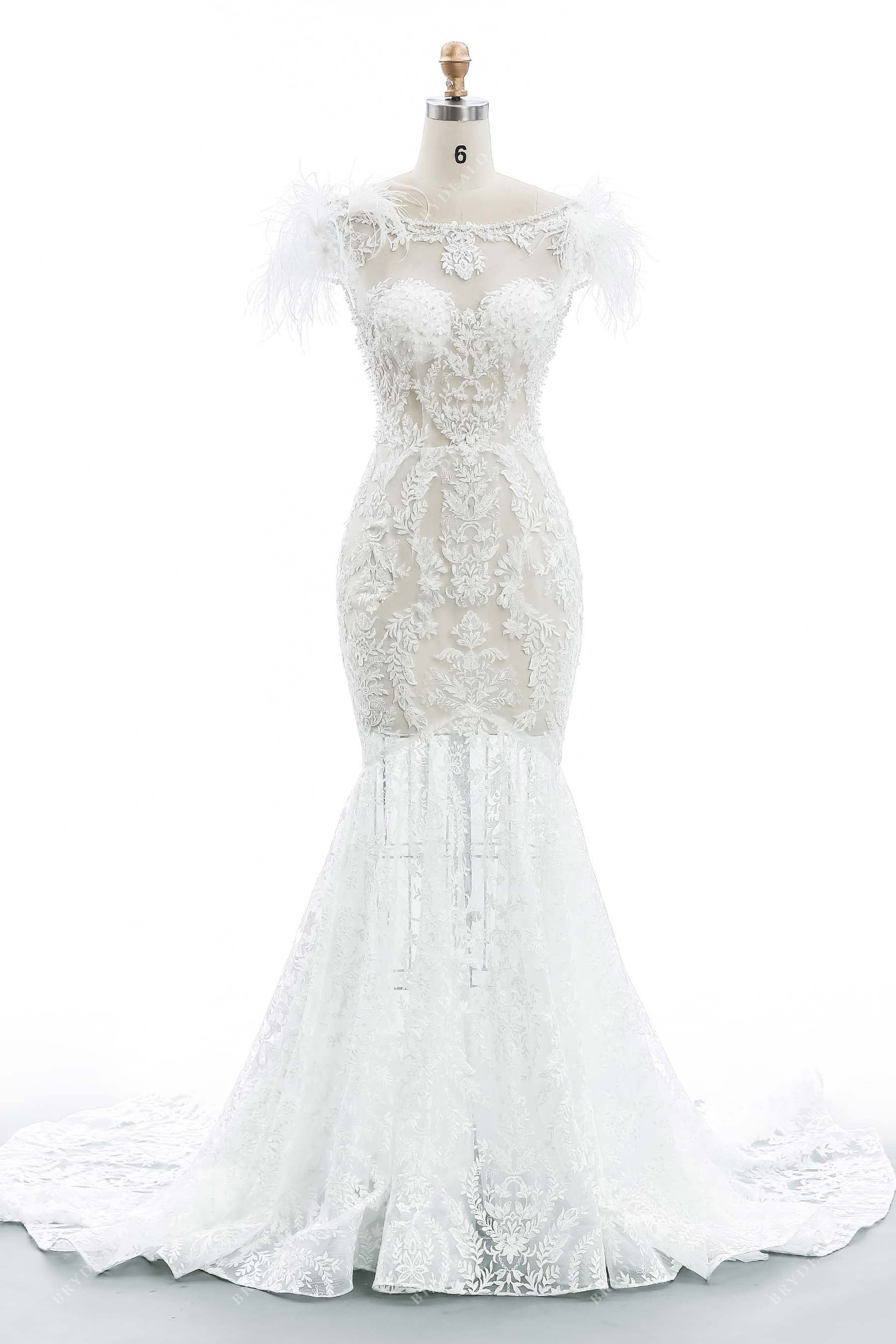 mermaid wedding dress with feathers Bella and Bloom Boutique