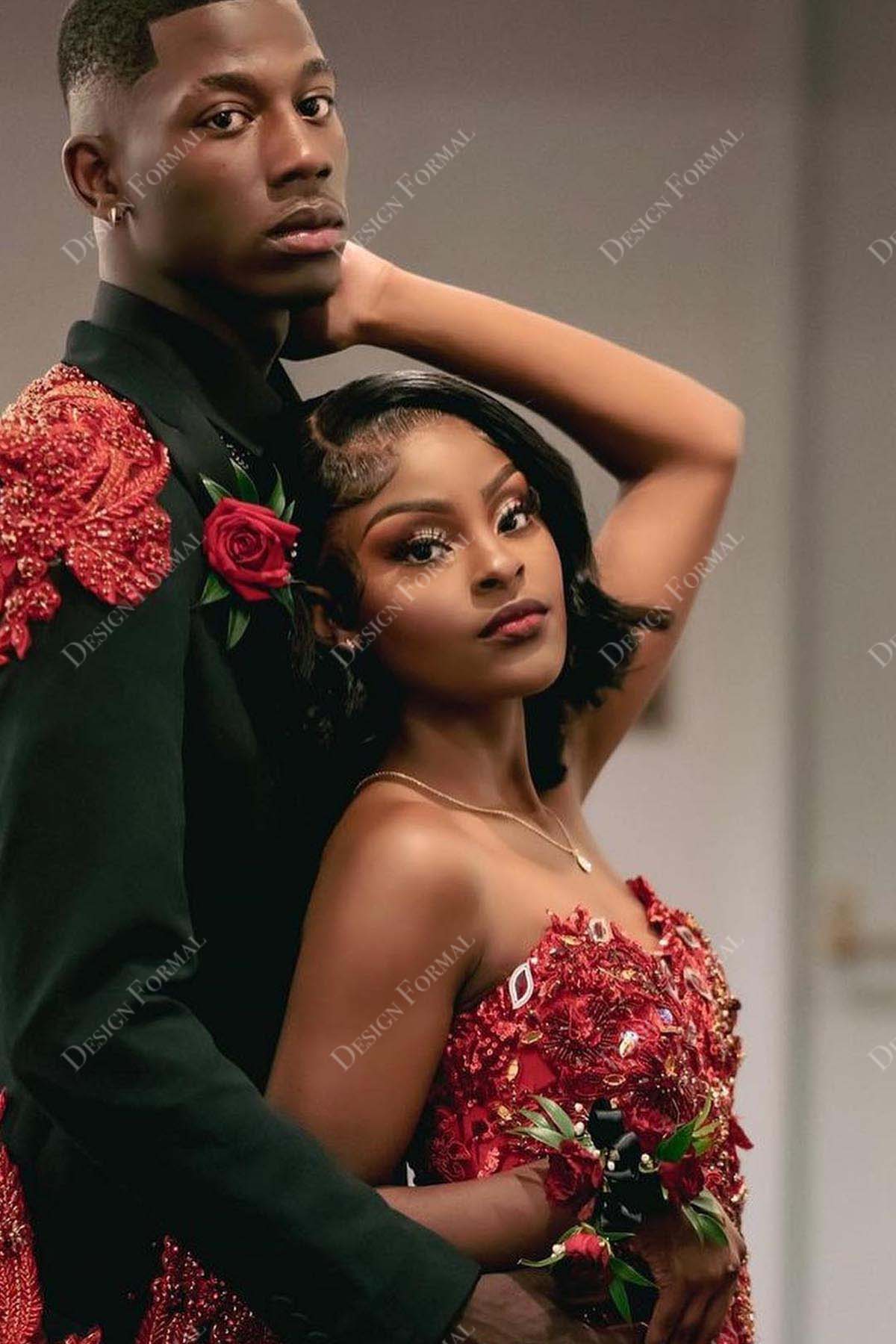 red sequin beaded feathered strapless prom gown
