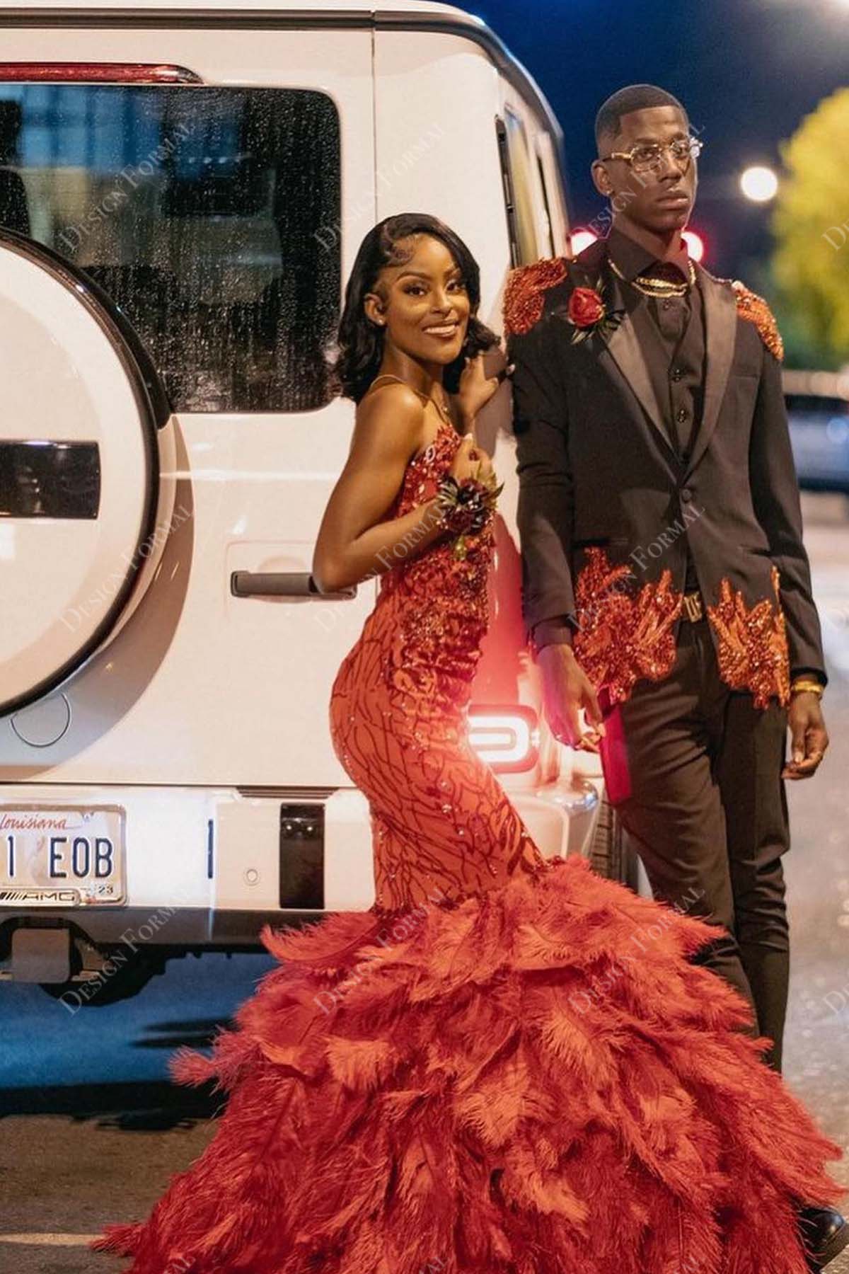 red sequin feathered trumpet prom gown