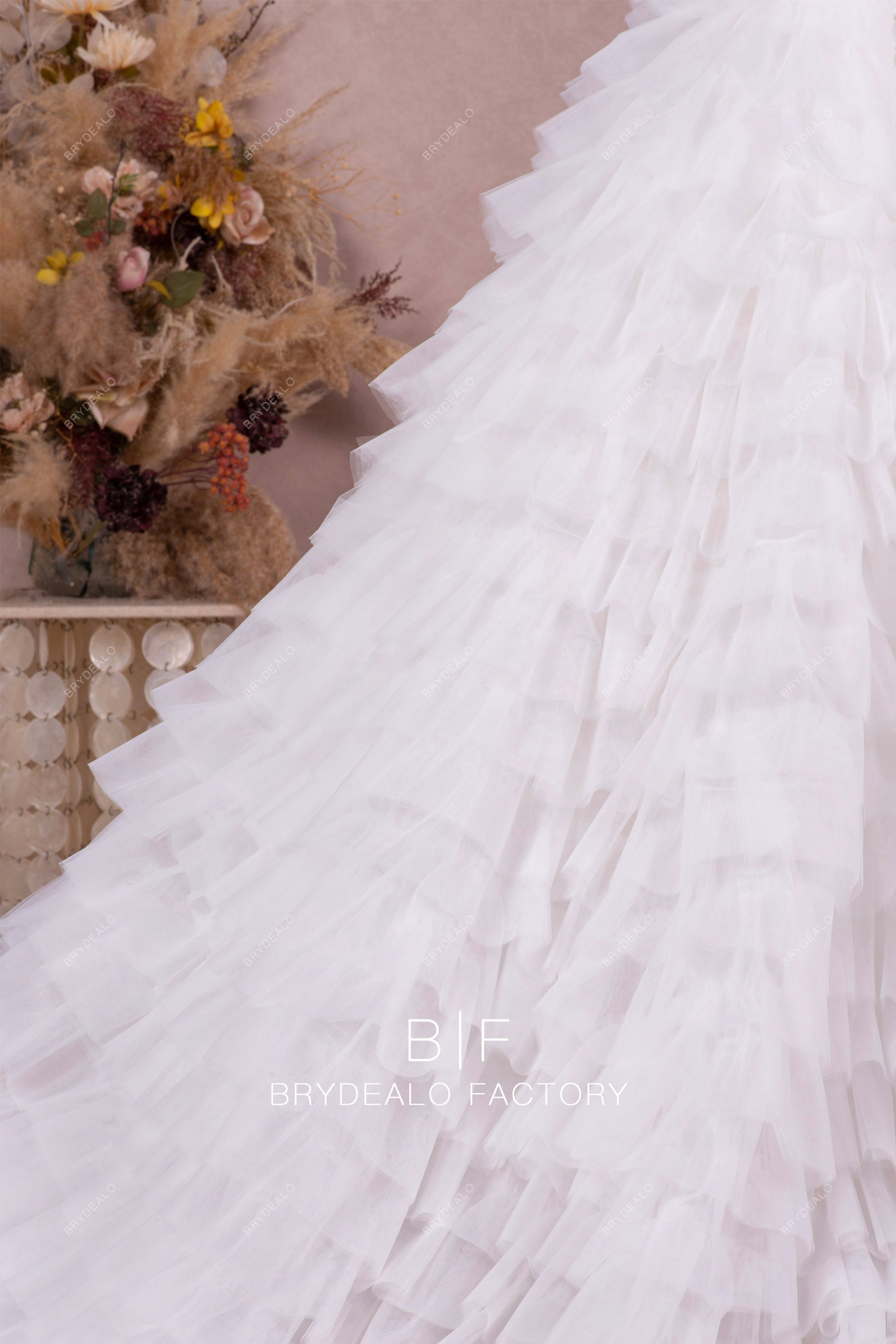 designer ruffled tulle A-line wedding dress