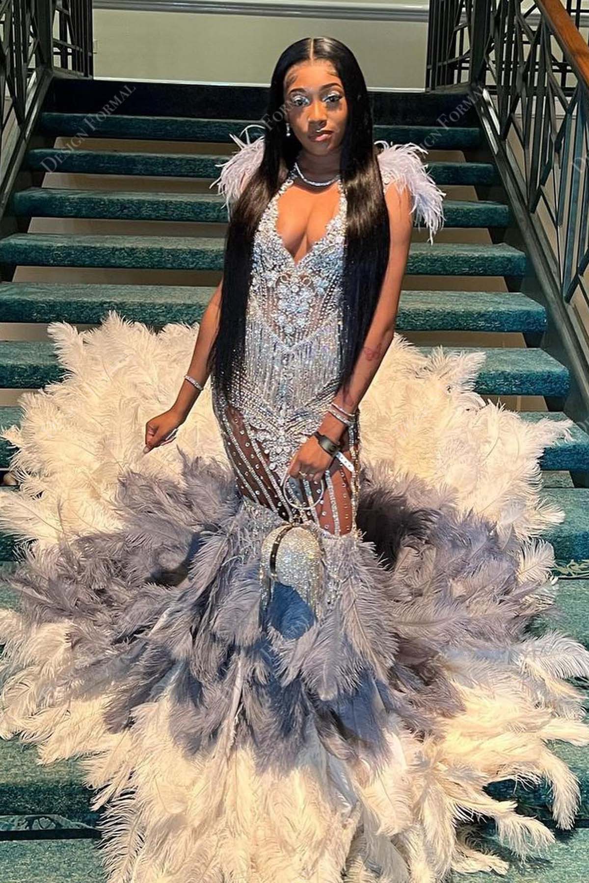 silver beaded feathered trumpet prom gown