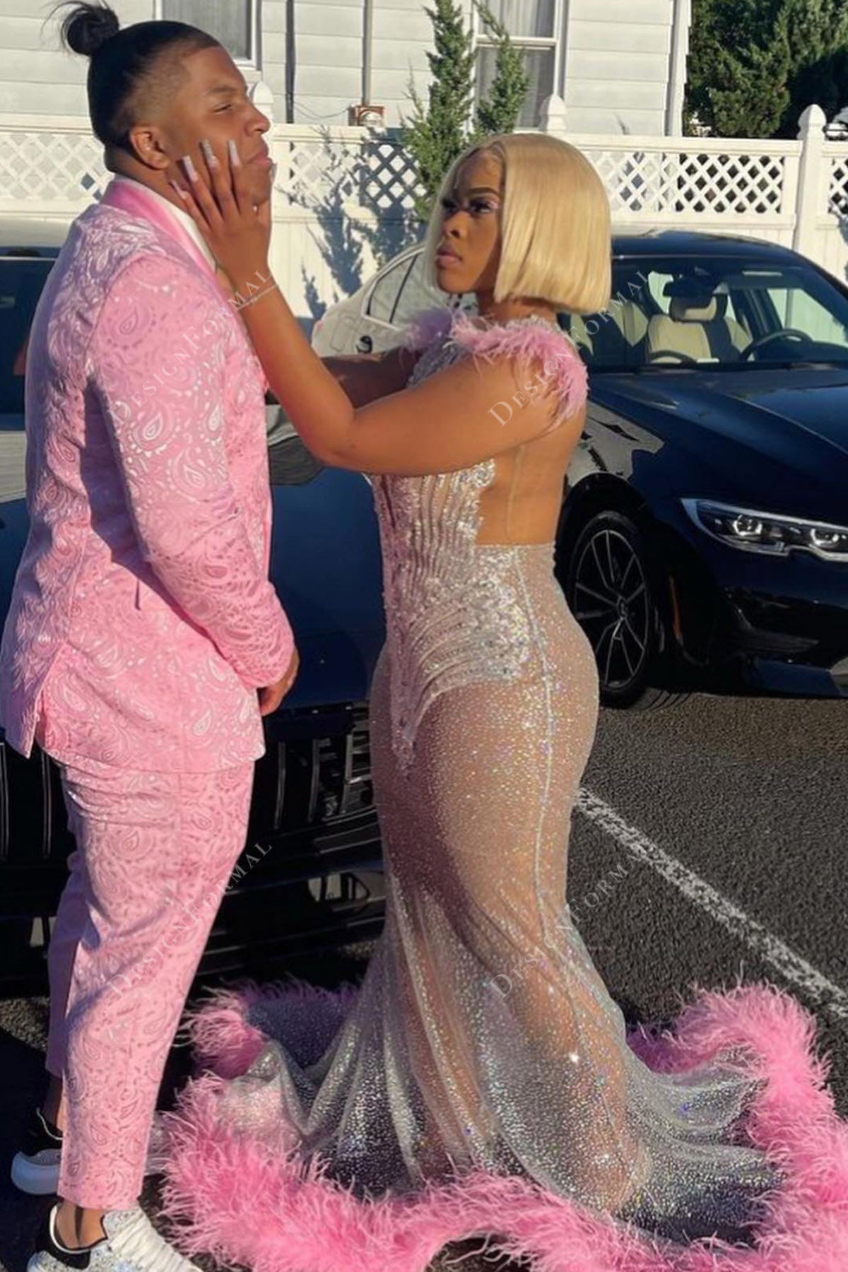 silver glitter sparkly embellished sheer prom gown with pink feathers