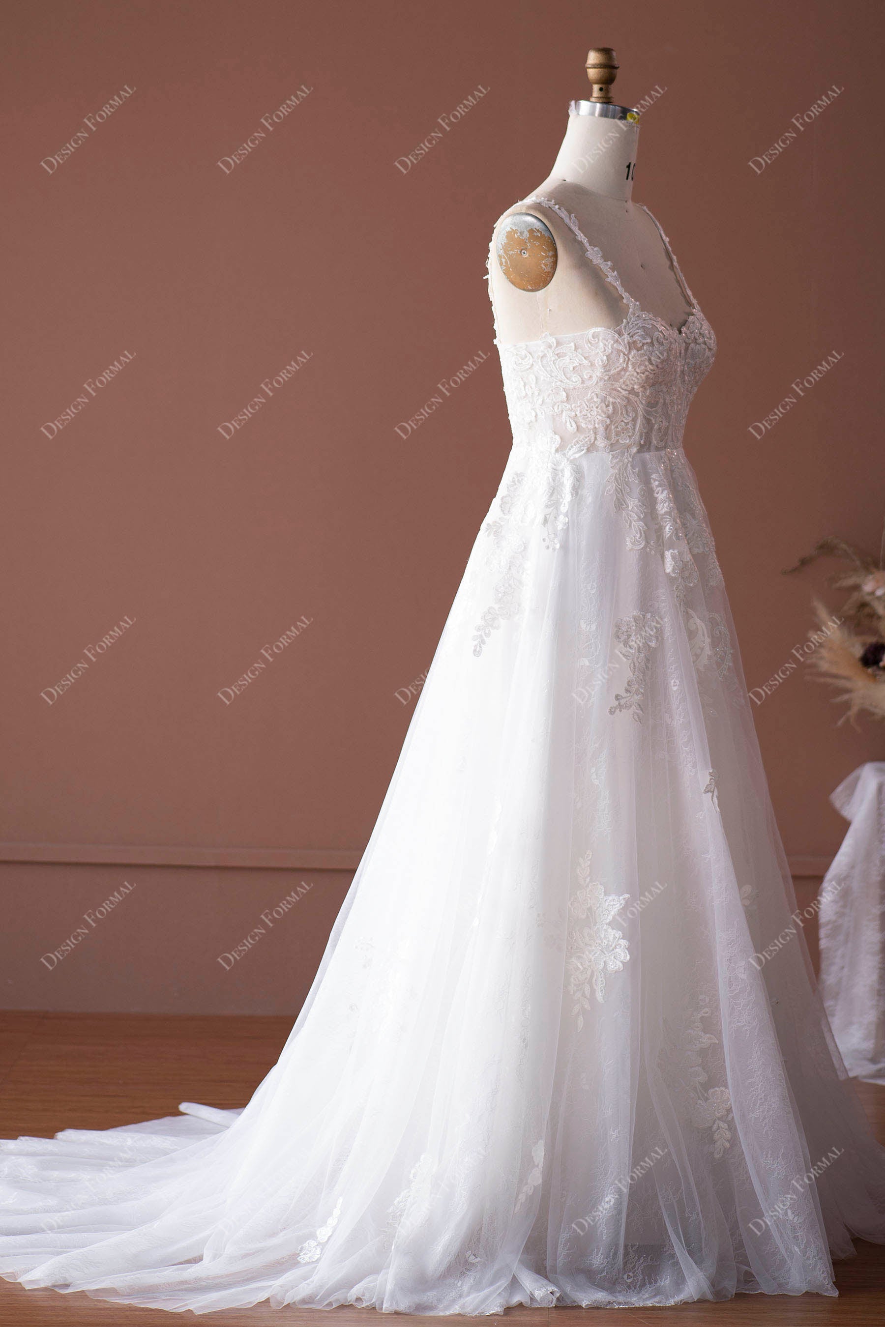 sleeveless lace appliqued A-line bridal dress