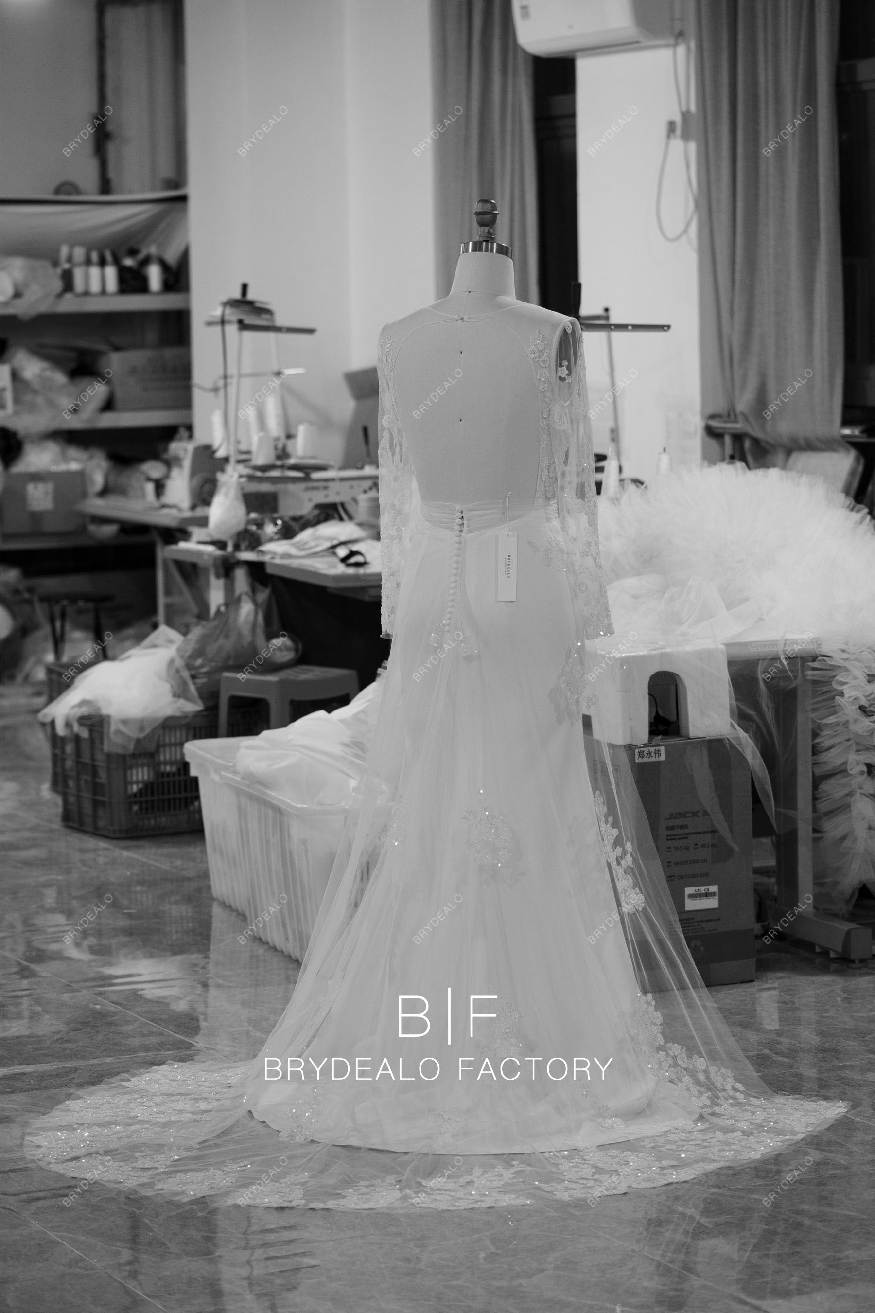 designer beaded lace sleeved crepe long wedding dress