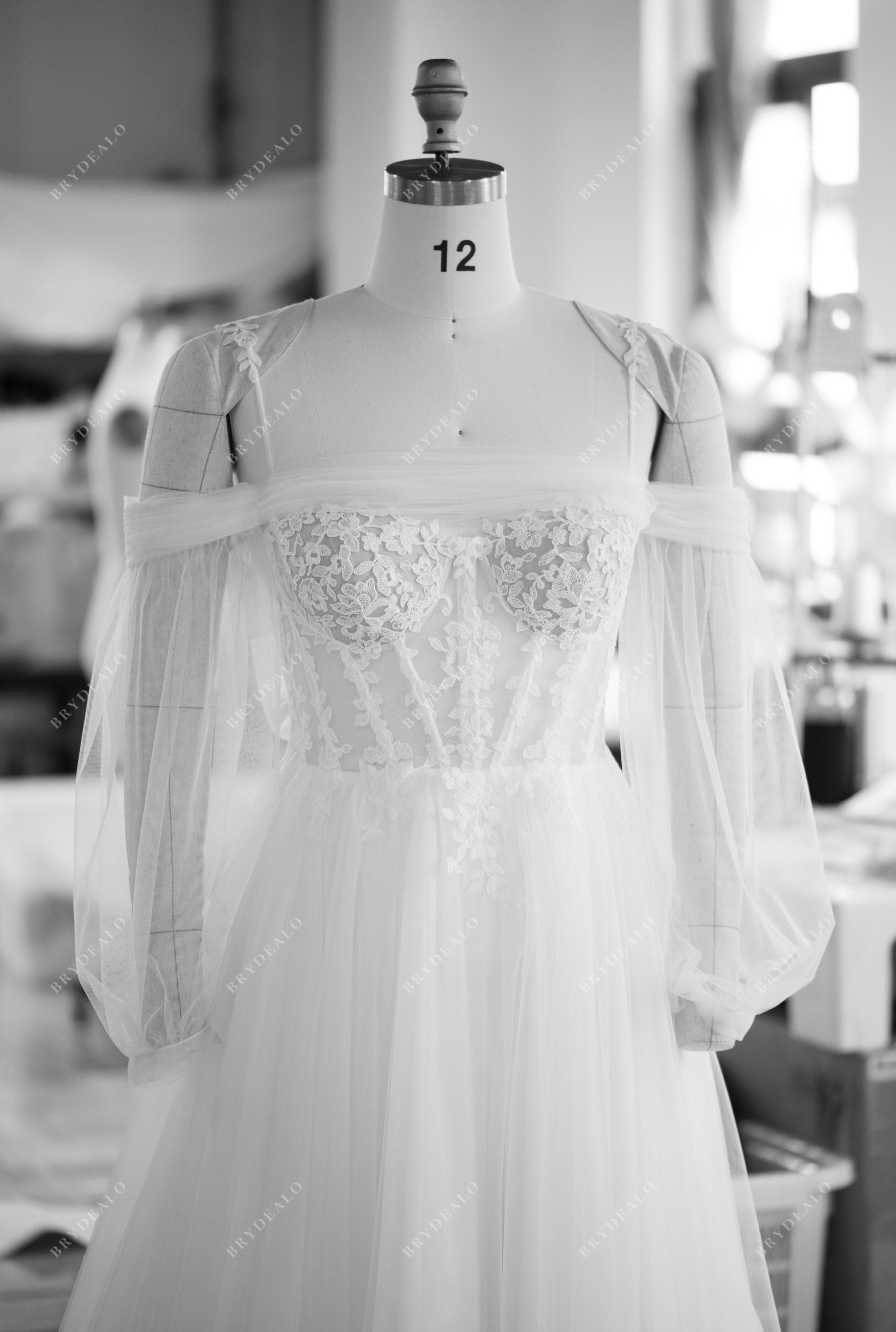 designer off shoulder sleeved lace corset wedding dress