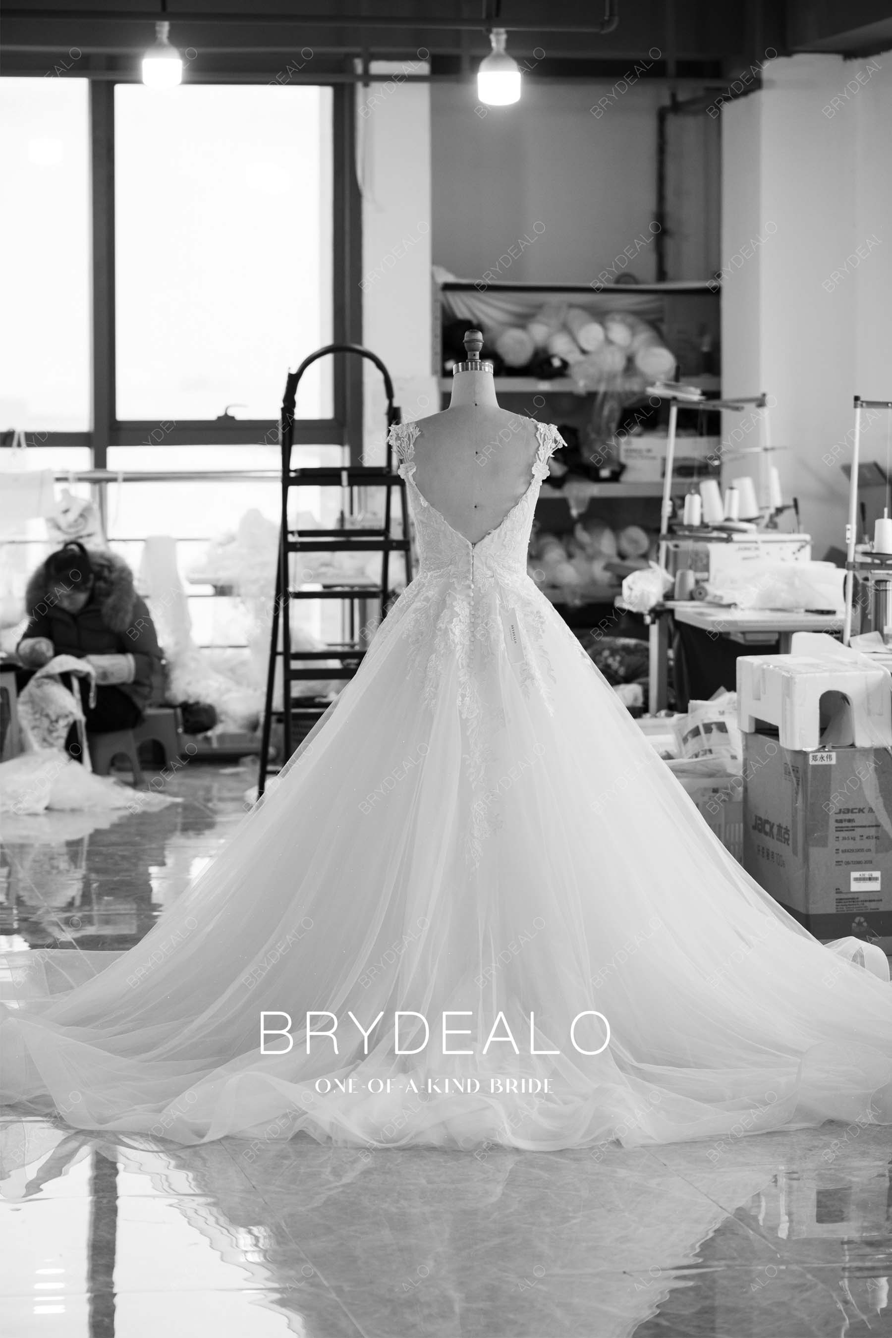 factory-direct long ruffled train open back destination wedding dress