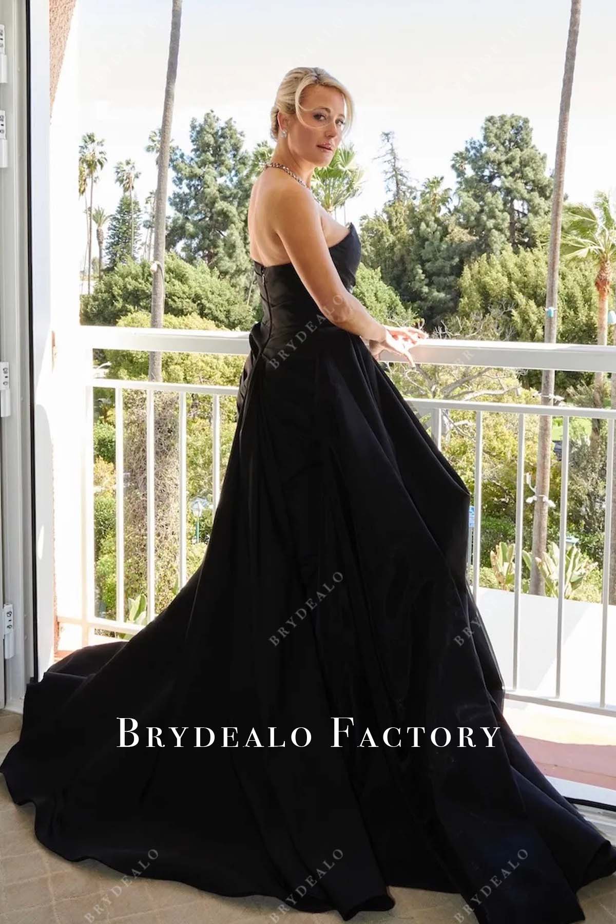 Briony Raymond black open back 2025 Oscars red carpet dress