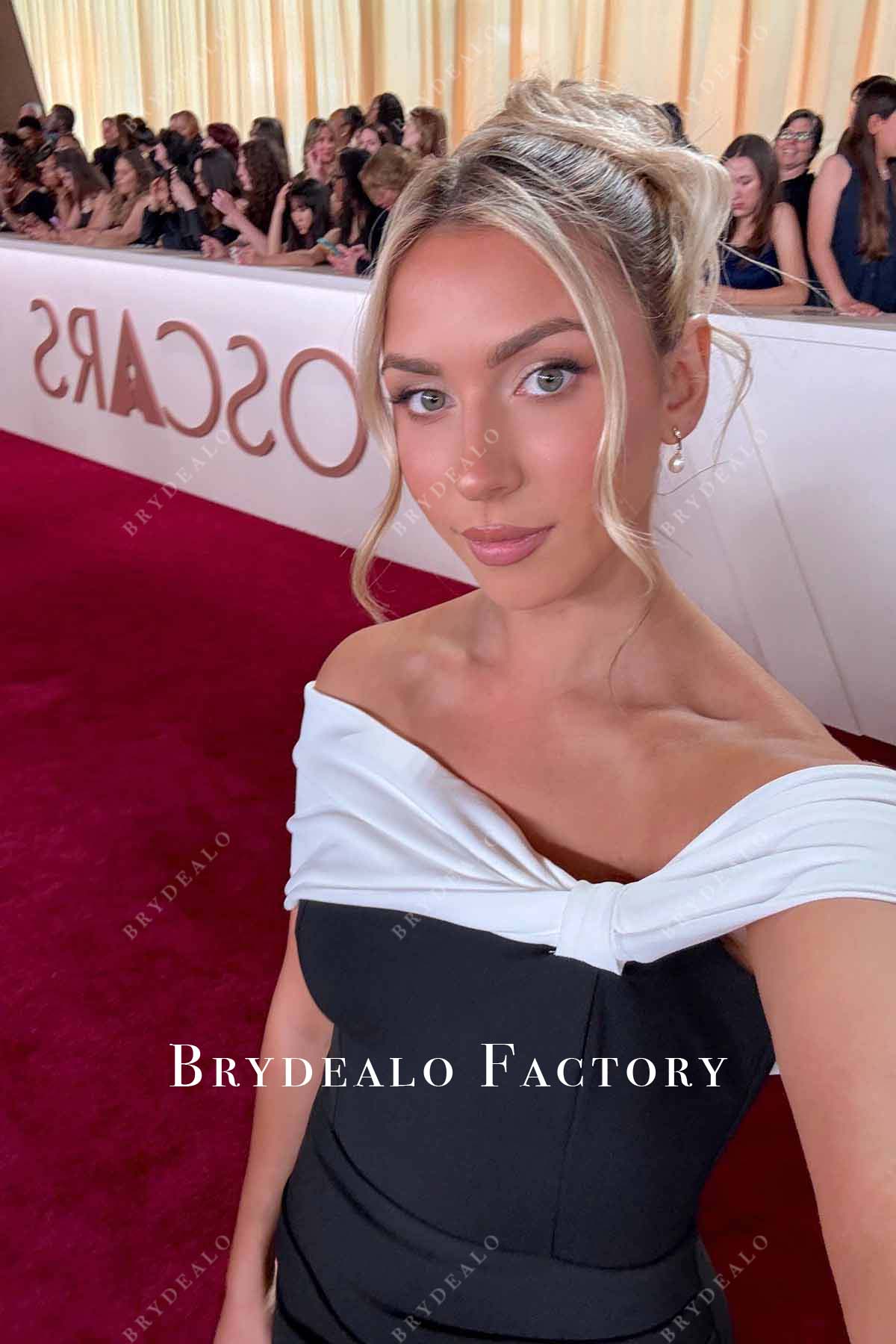 Katie Feeney asymmetrical neckline 2025 Oscars red carpet dress