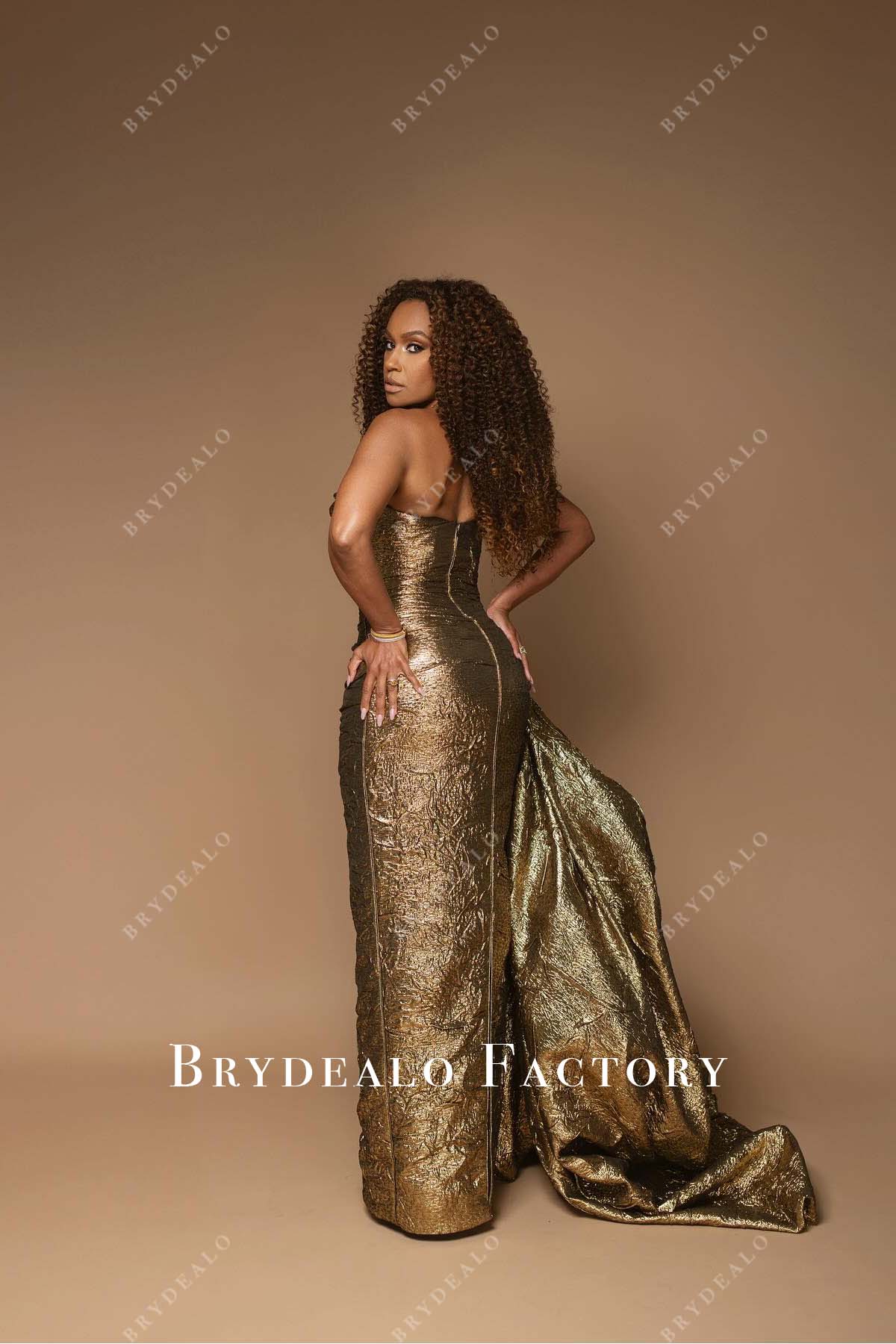 Ryan Michelle Bathe metallic gold 2025 Oscars red carpet open back dress