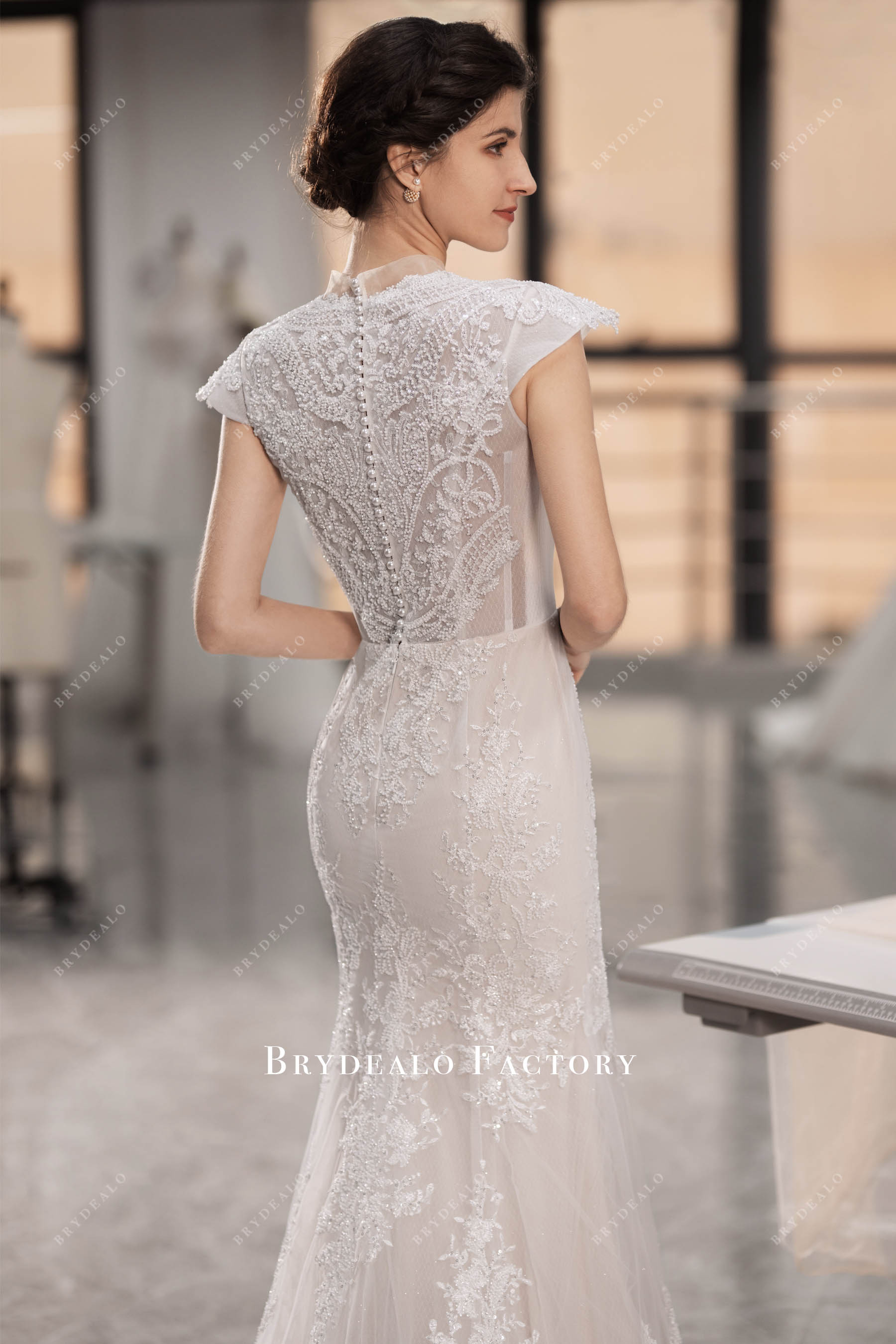 beaded lace illusion back fit and flare champagne bridal gown