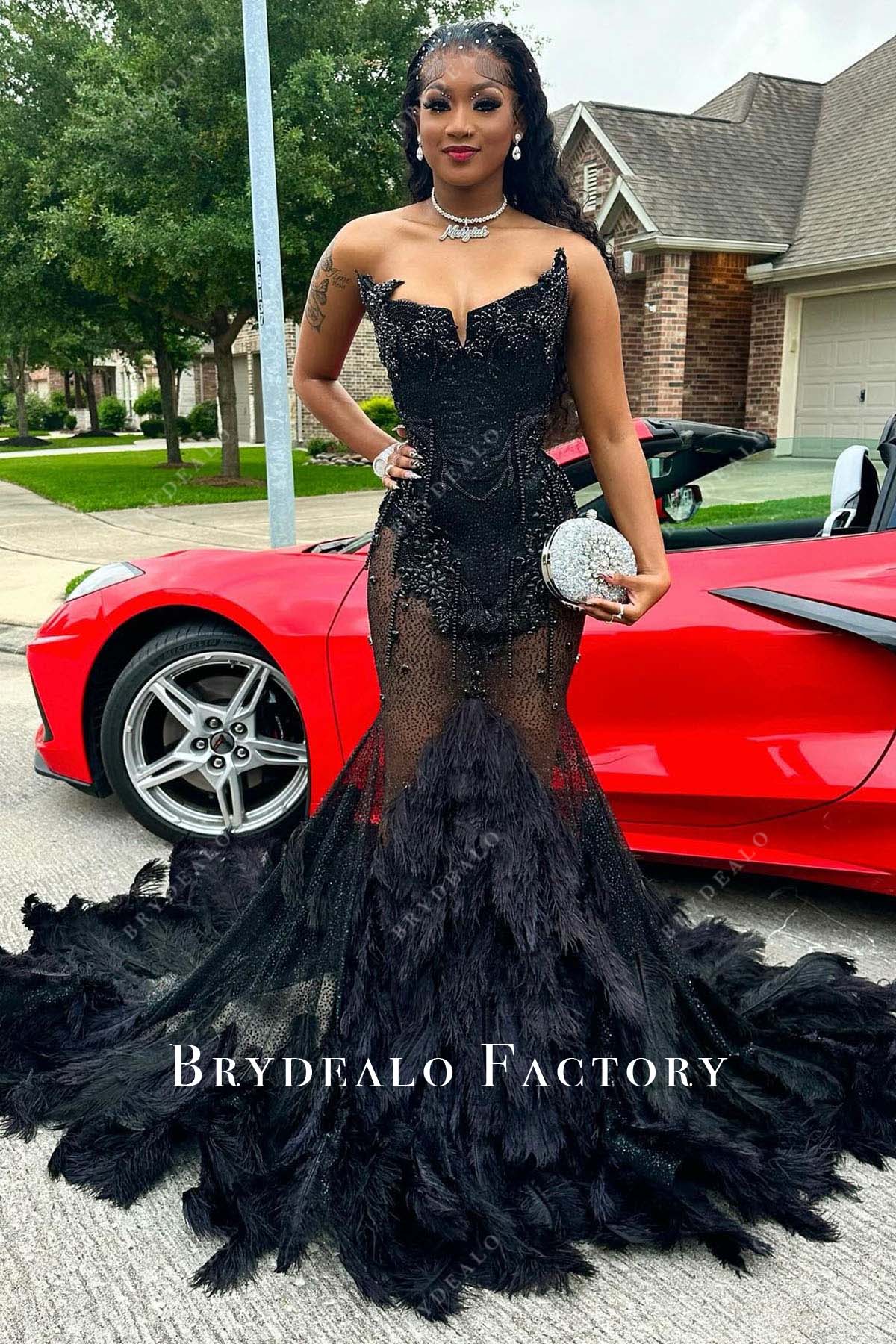 black strapless trumpet feathered prom dress