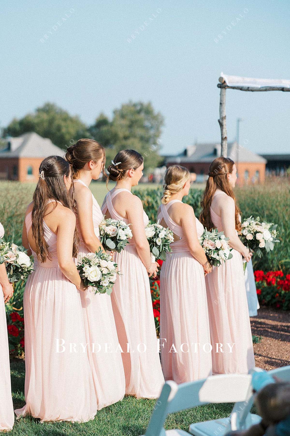 blushing pink crisscross back floor length bridesmaid dress