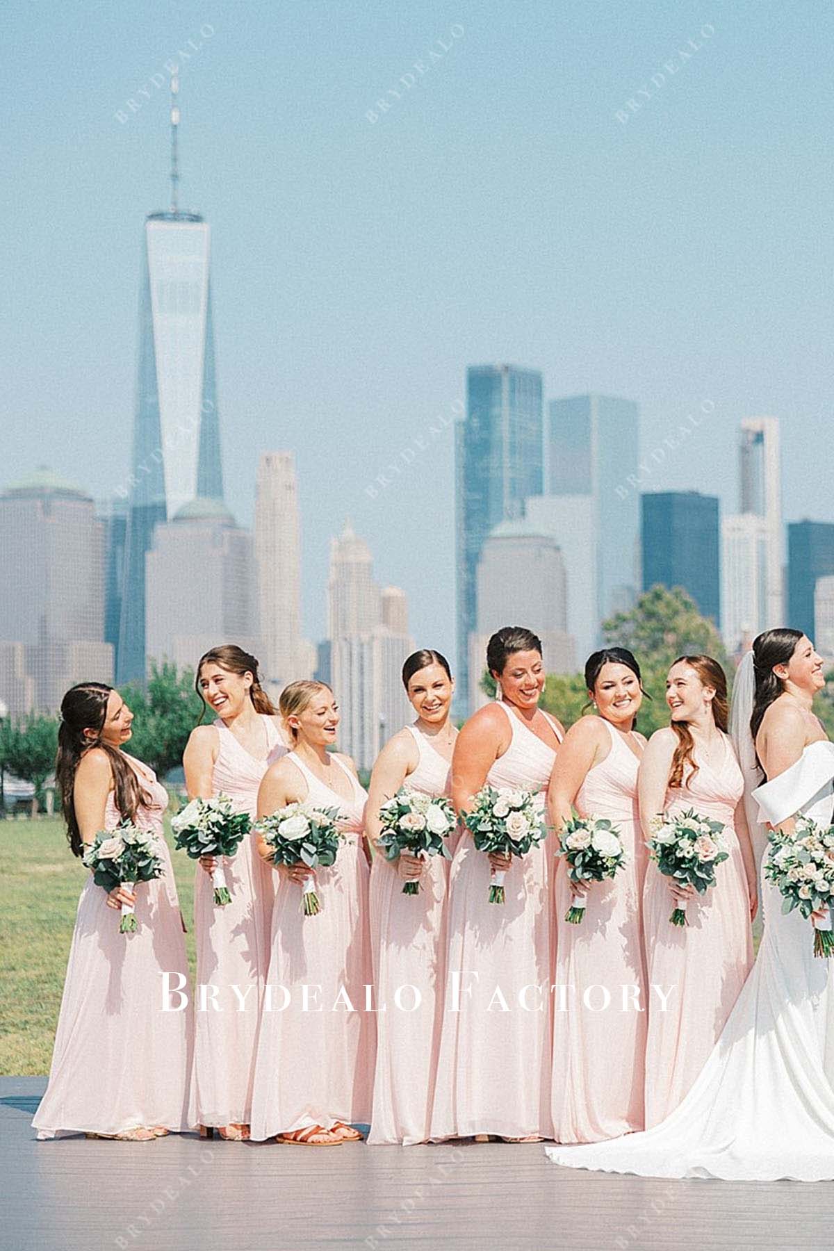 blushing pink v neck pleated floor length bridesmaid dress