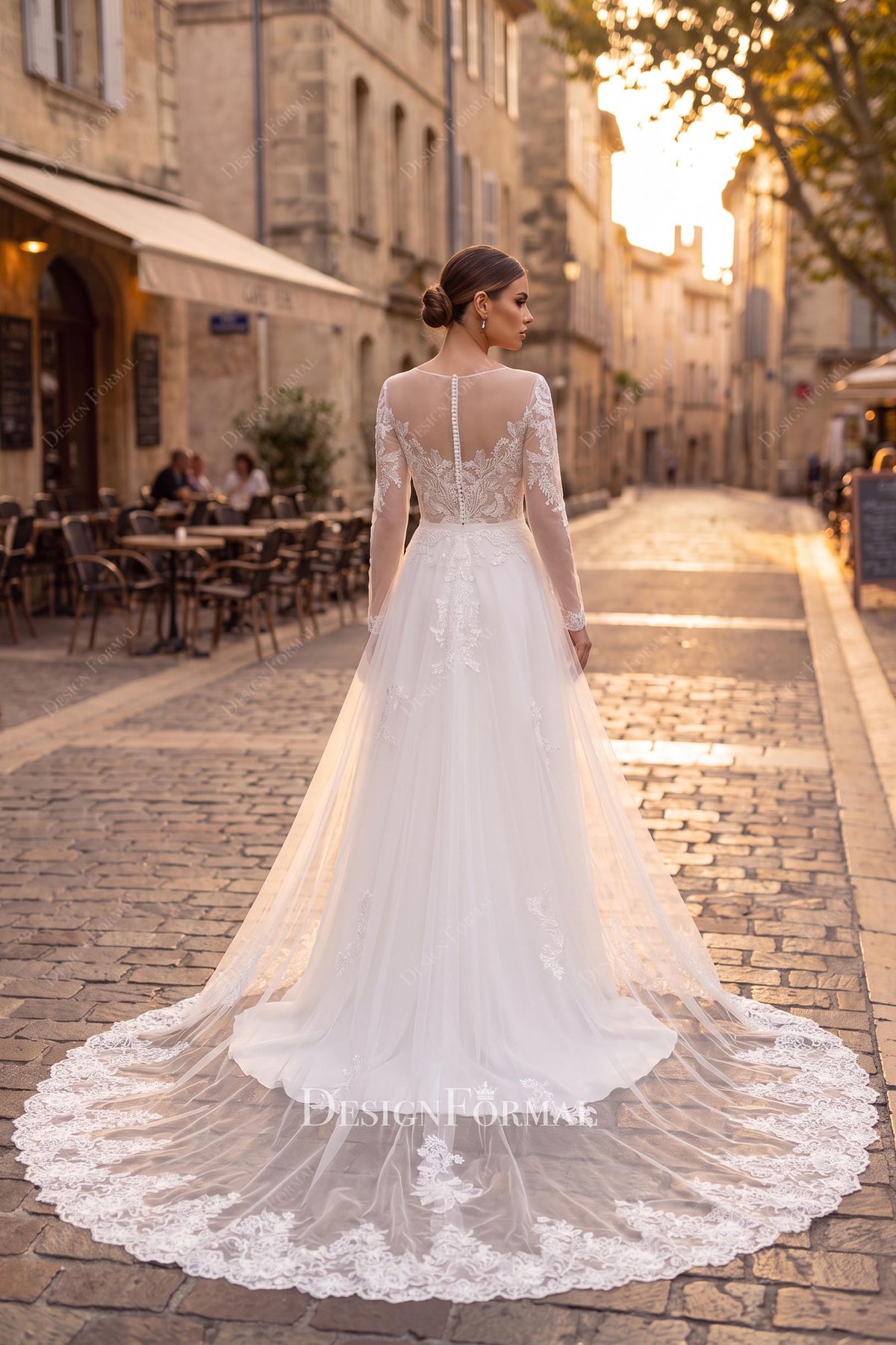 buttoned illusion back wedding dress