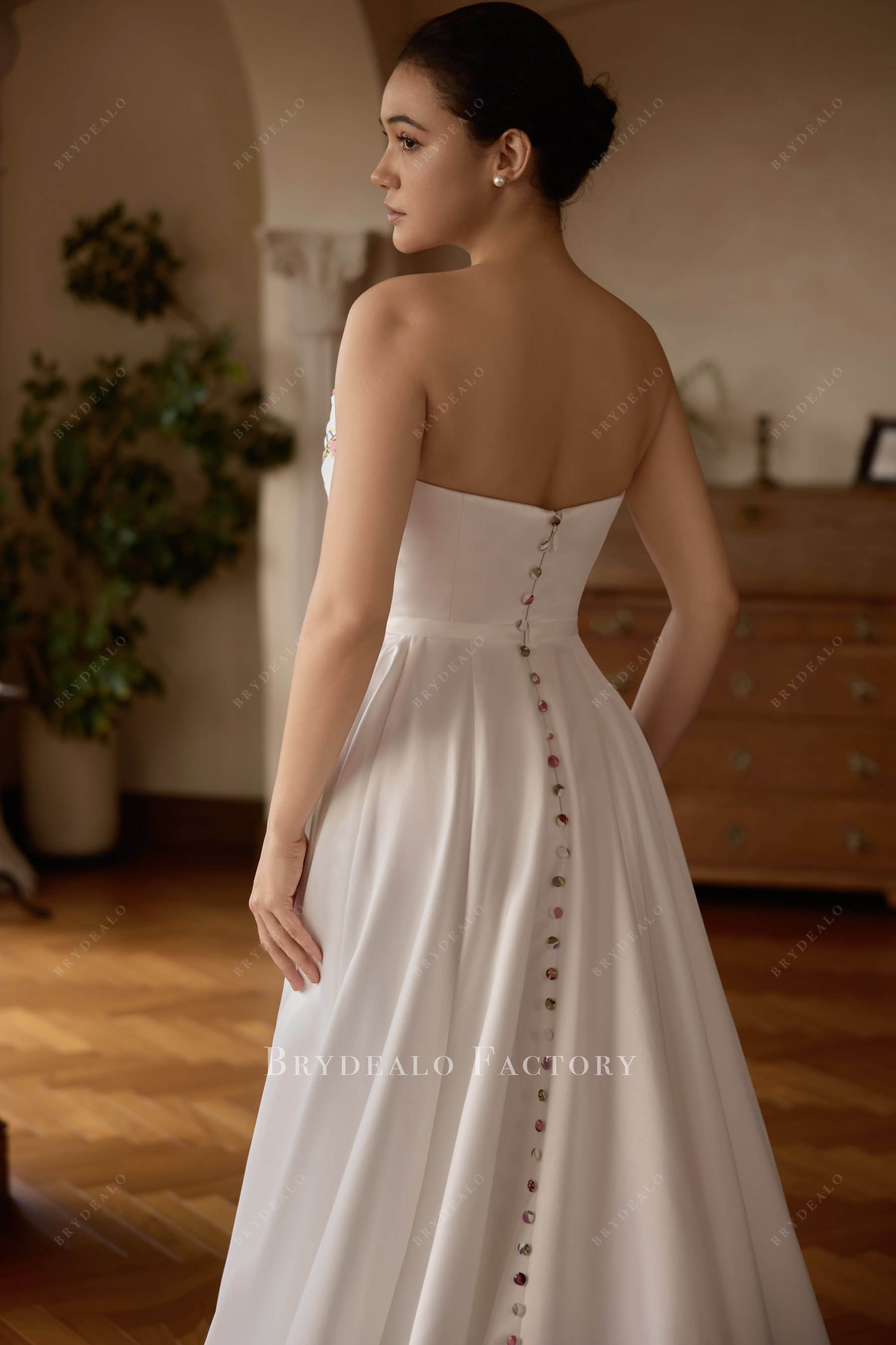 buttoned open back bridal gown