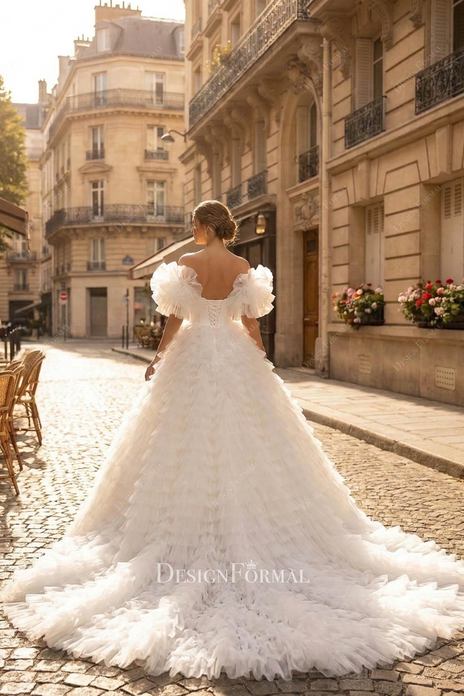 dramatic tiered tulle long train bridal gown