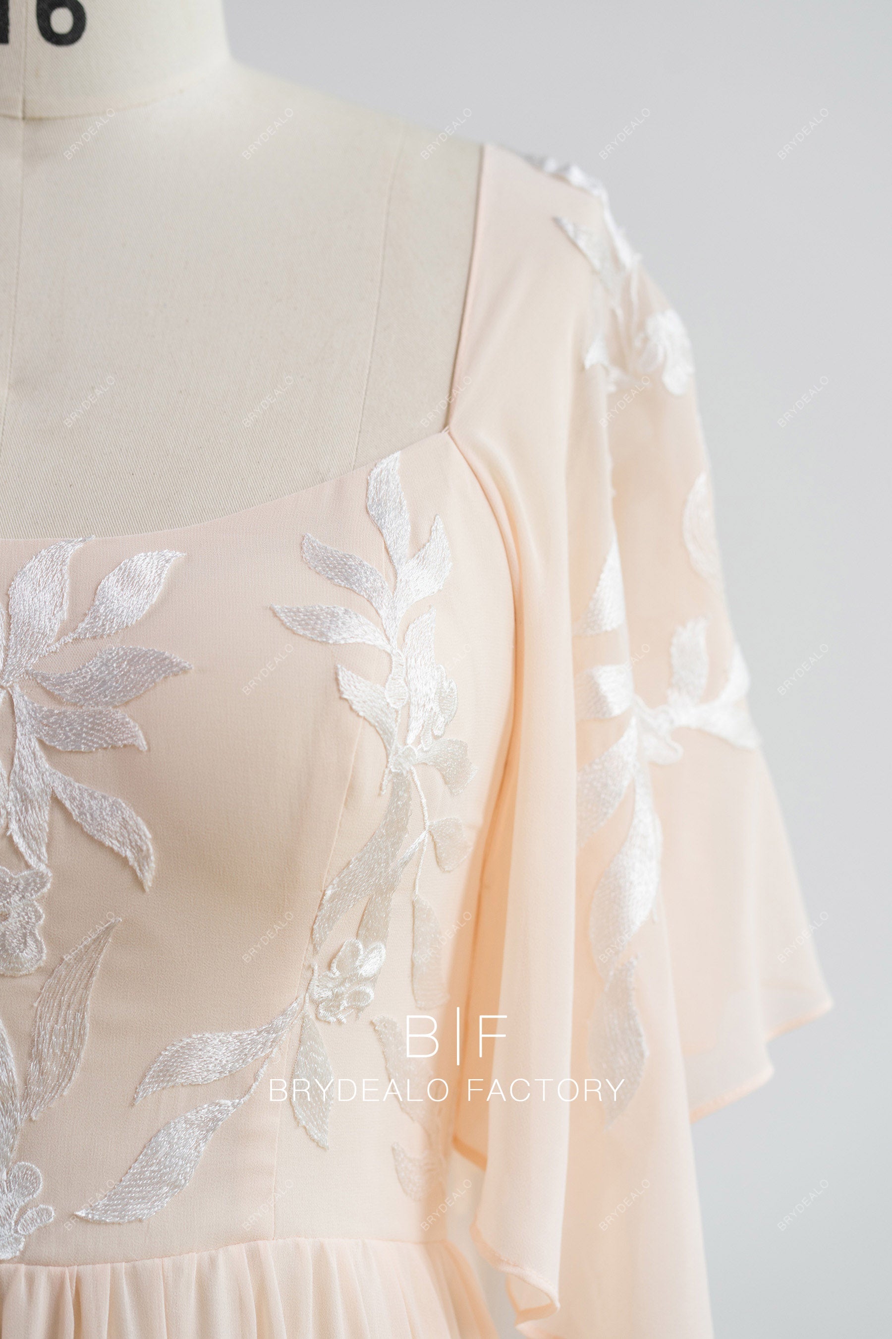 flowing chiffon sleeve peach bridesmaid dress