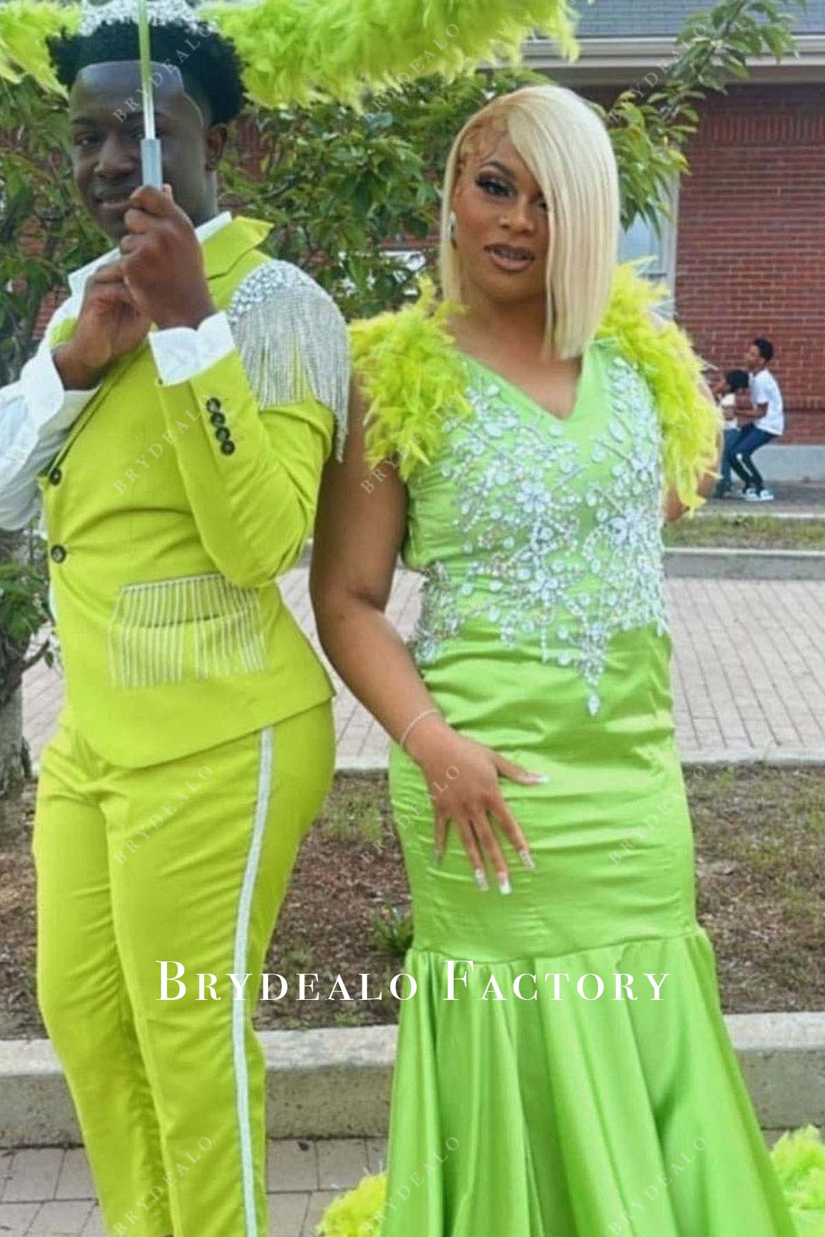 green feathered trumpet prom dress