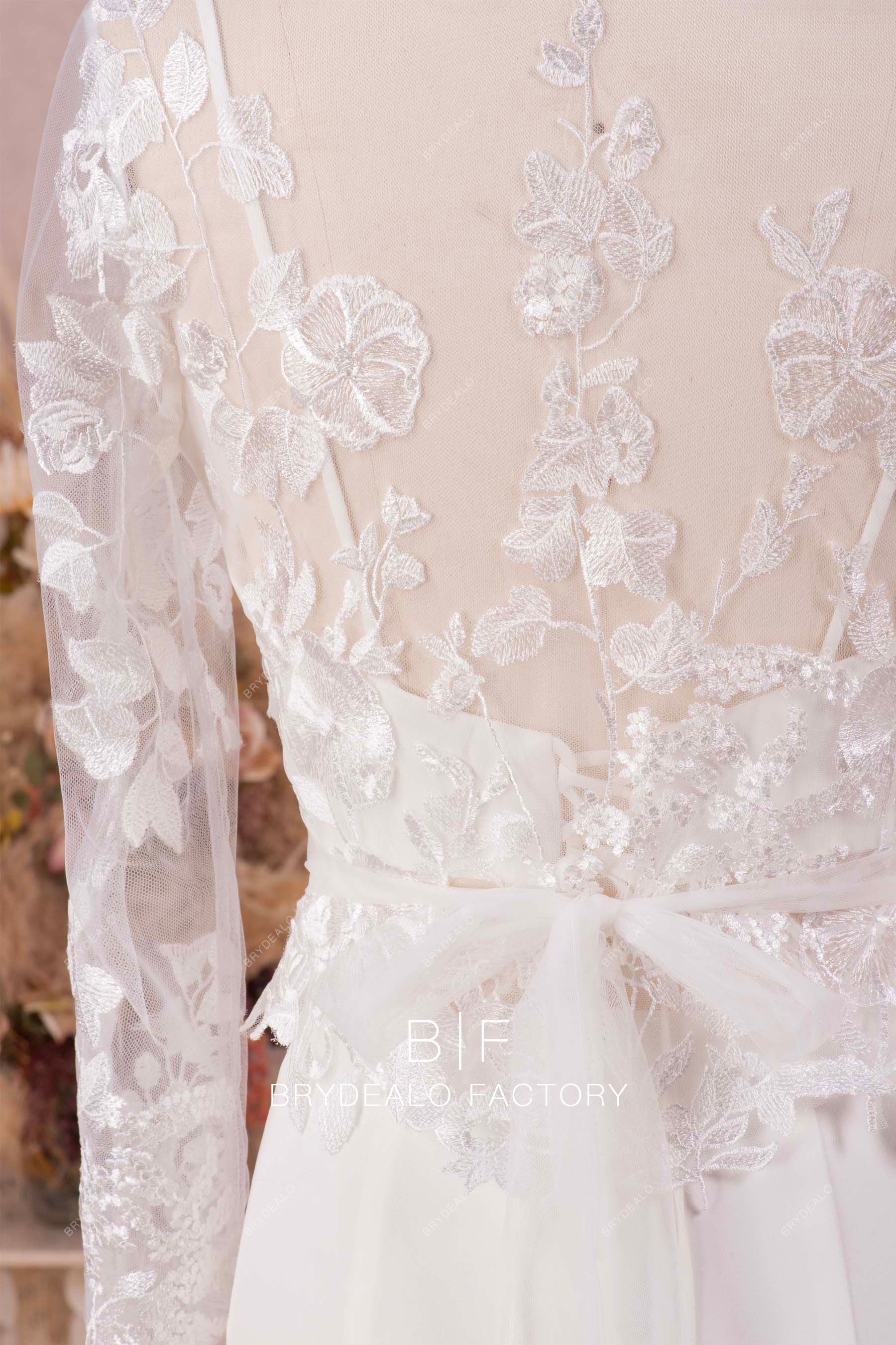 illusion back designer lace wedding gown