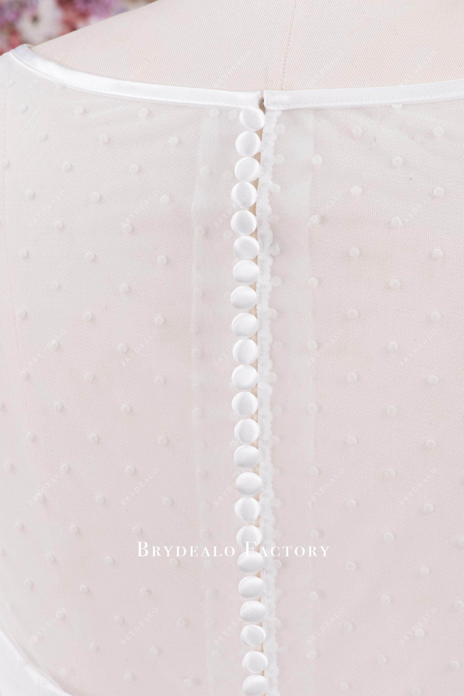 illusion buttoned back bridal dress