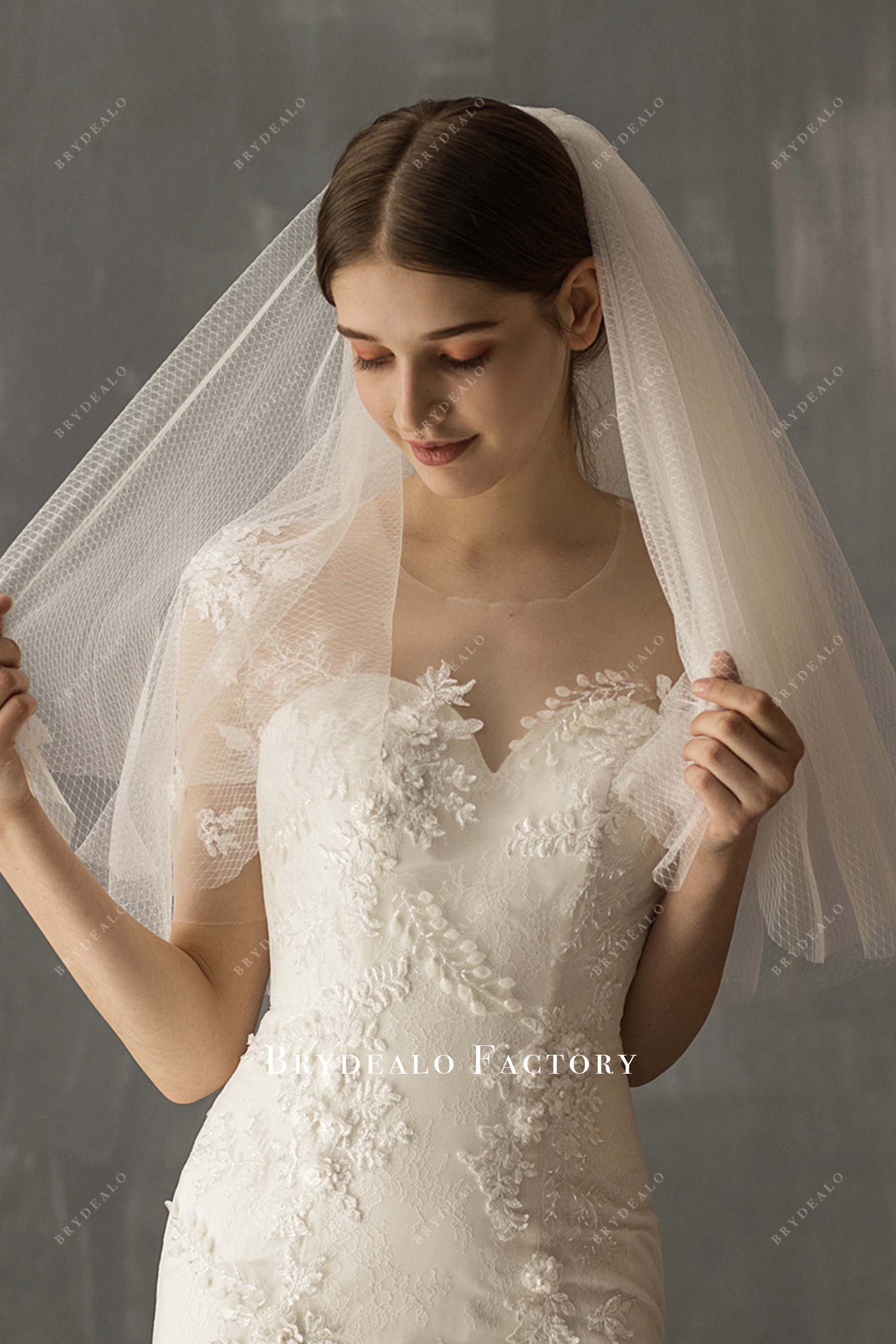 layered with comb bridal veil