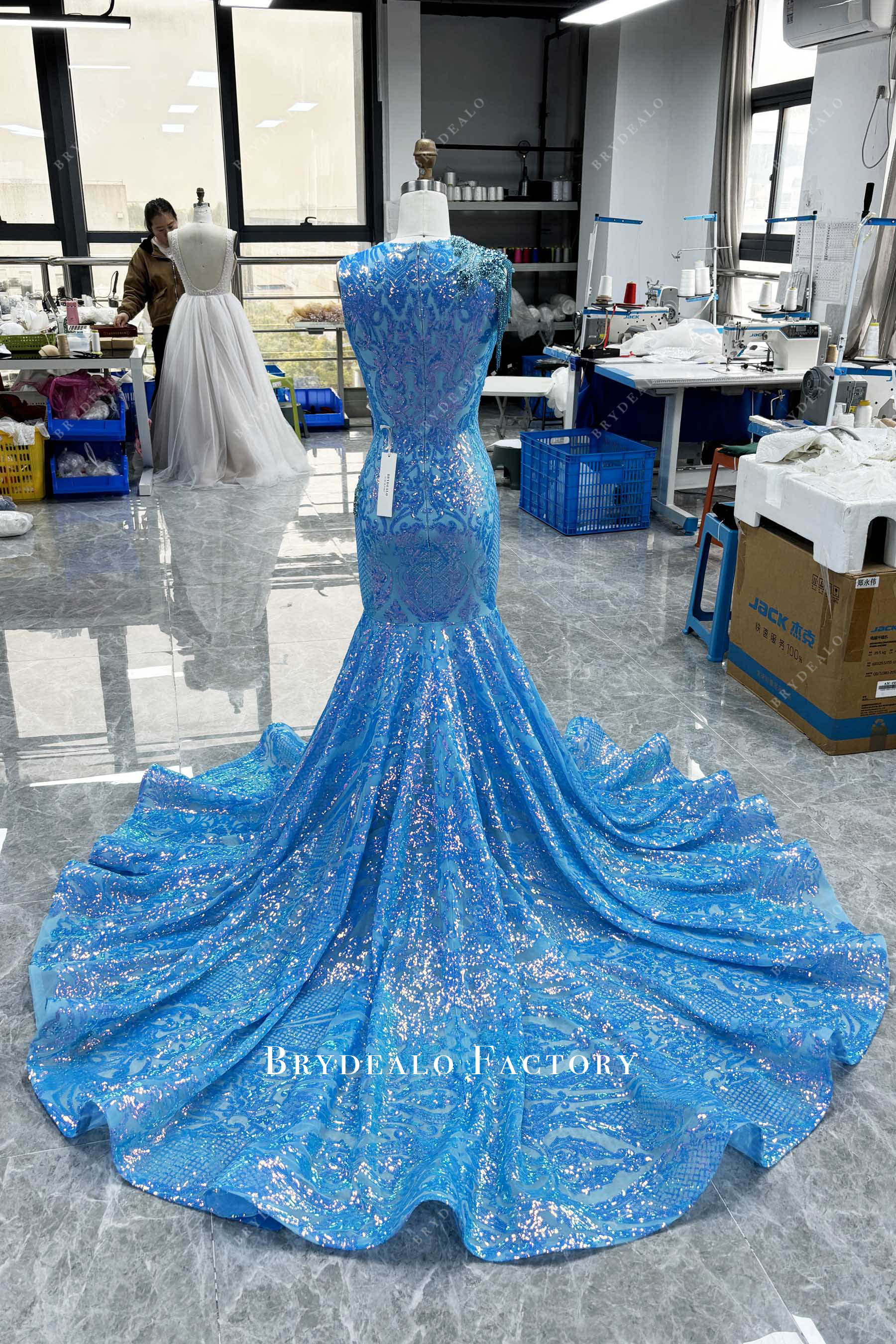 designer long ruffled train prom gown